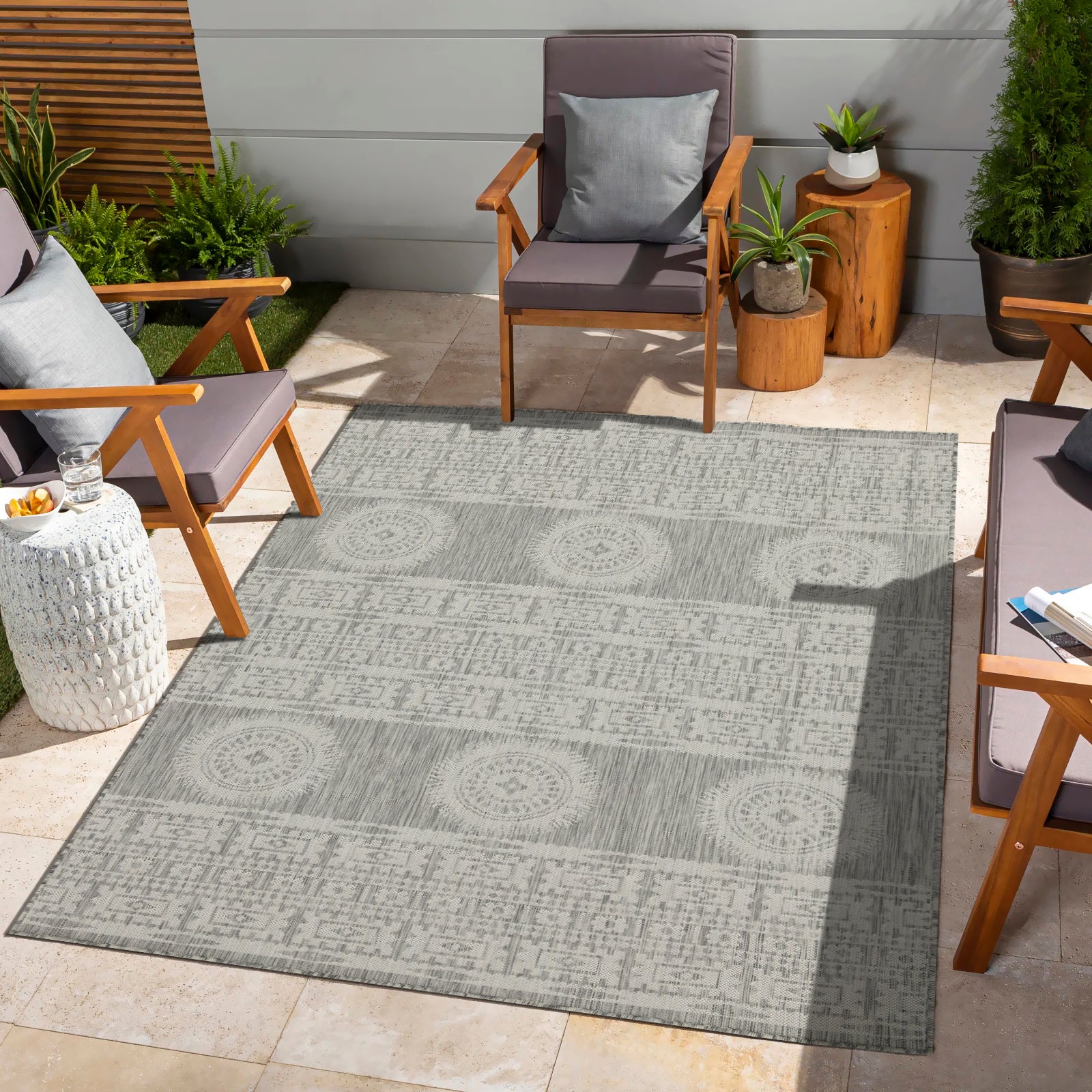 Gray tribal patterned outdoor rug with geometric and circular motifs