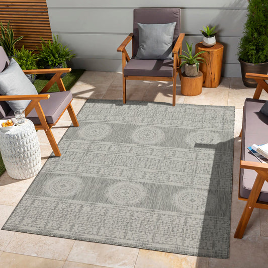 Gray tribal patterned outdoor rug with geometric and circular motifs