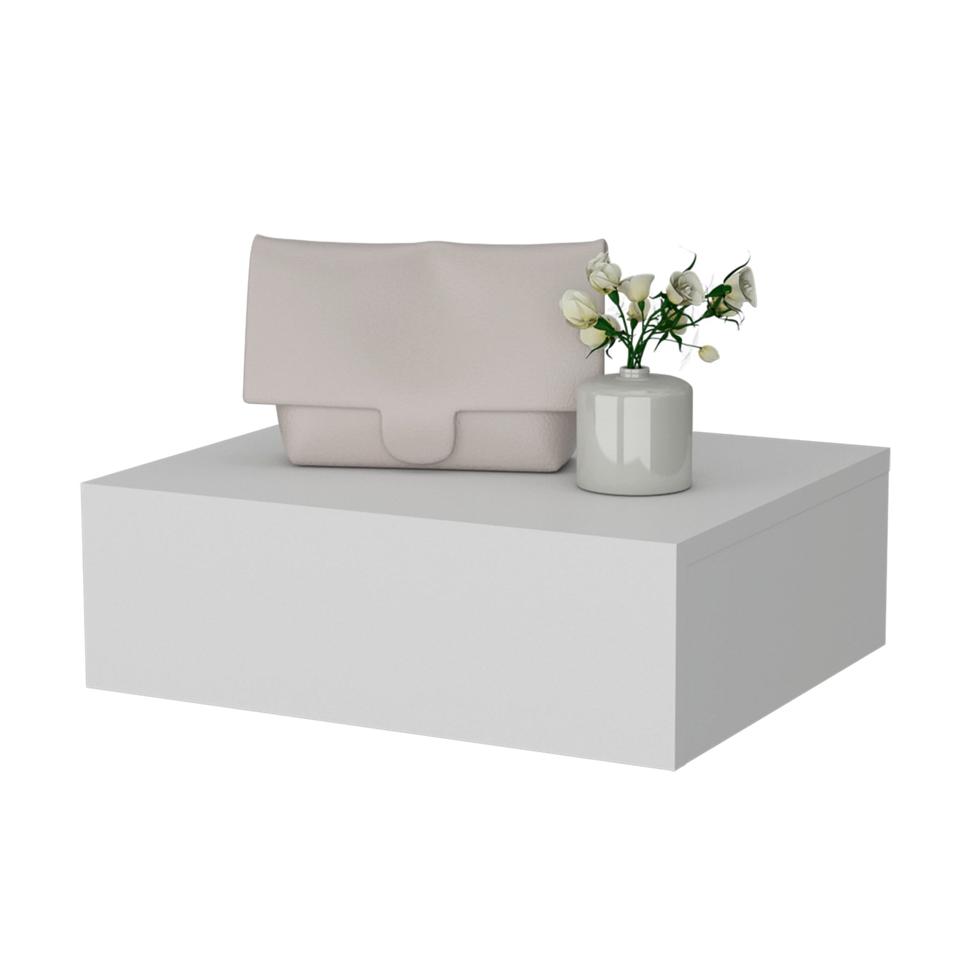 A pale pink textured leather clutch bag with a smooth flap closure rests on a white display pedestal