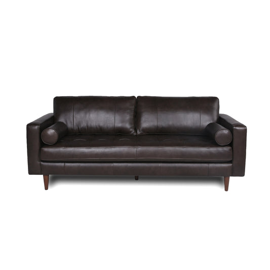 Dark brown tufted leather couch with bolster armrests and tapered wooden legs