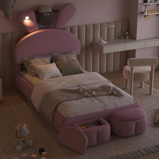 Pink upholstered kids bed with rabbit ear headboard and builtin storage