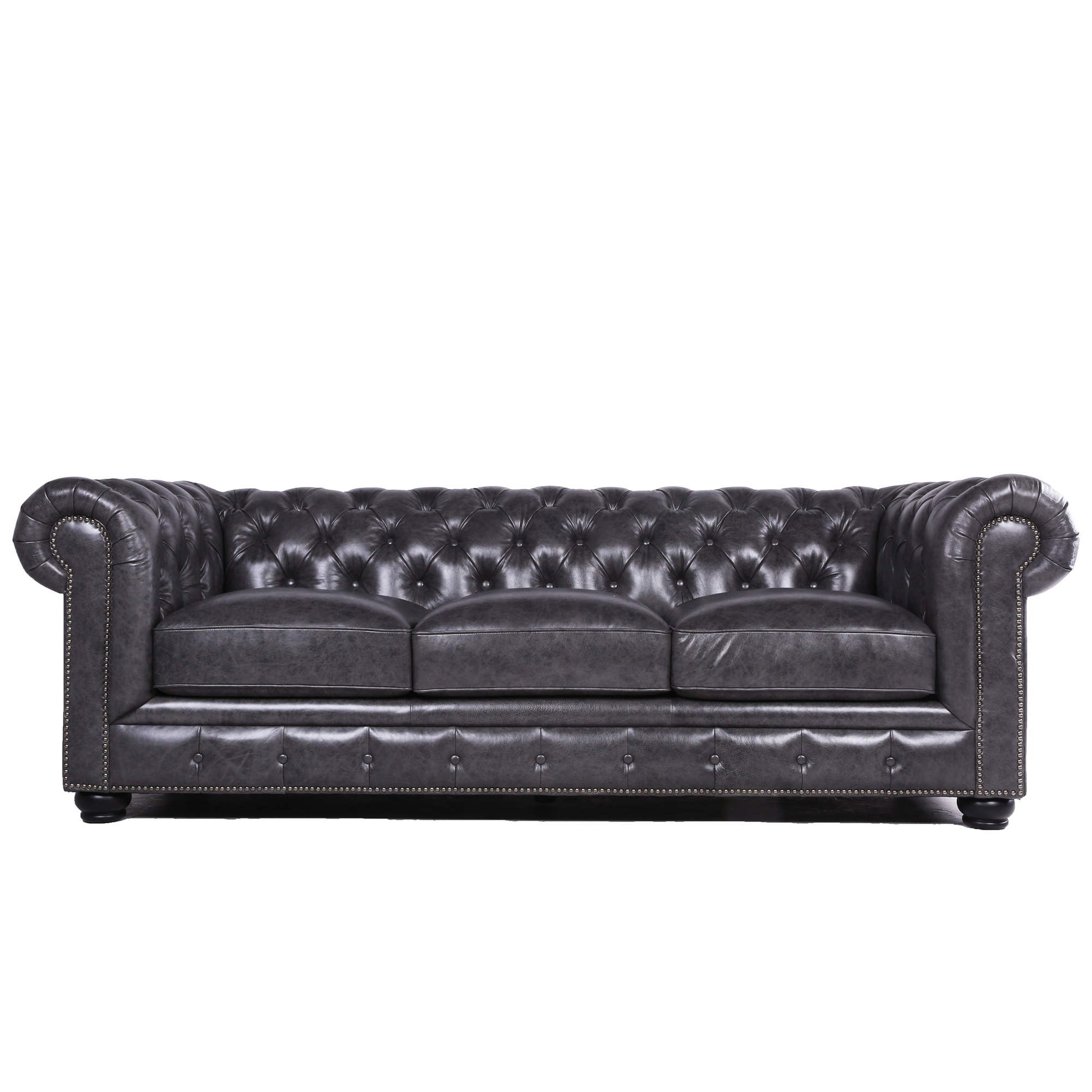 Dark gray tufted leather sofa with silver nailhead trim and rolled arms