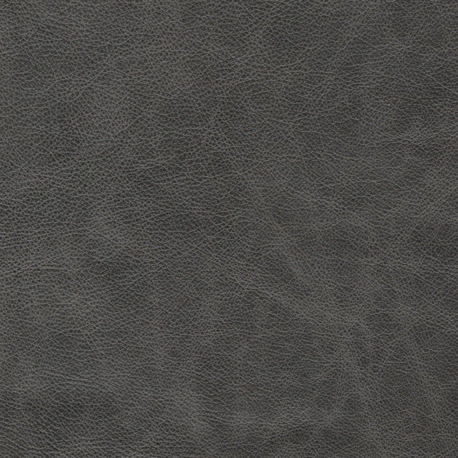 Textured charcoal grey faux leather upholstery fabric with a subtle grain pattern