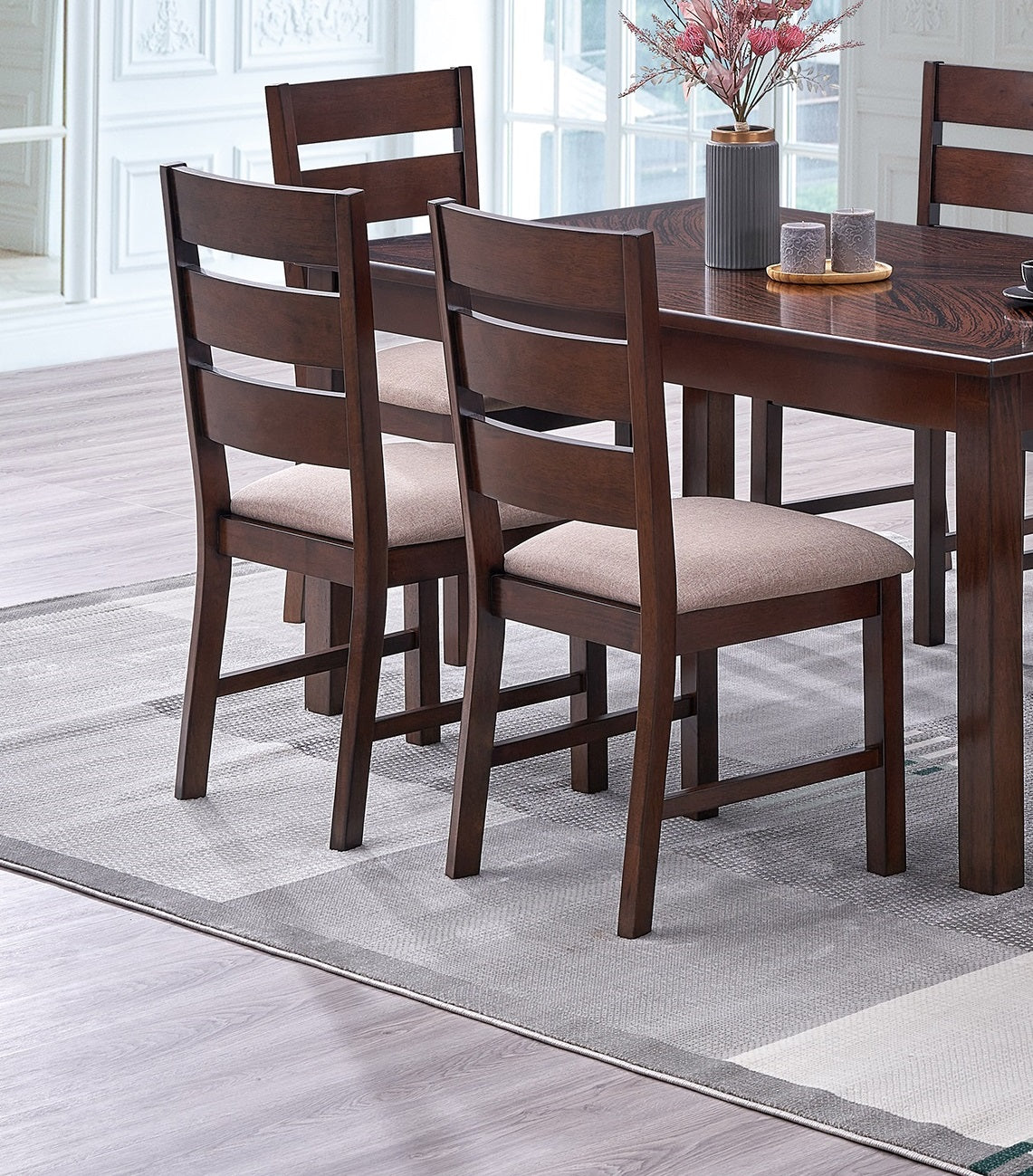 Dark brown wooden dining chairs with beige upholstered seats and slat backs