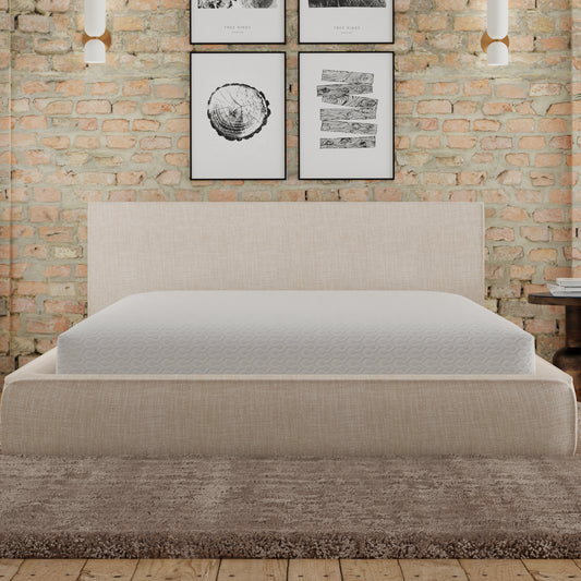Beige upholstered bed frame with a white textured mattress ideal for a modern bedroom