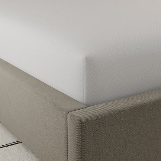 White fitted sheet with subtle geometric pattern soft cotton blend fabric