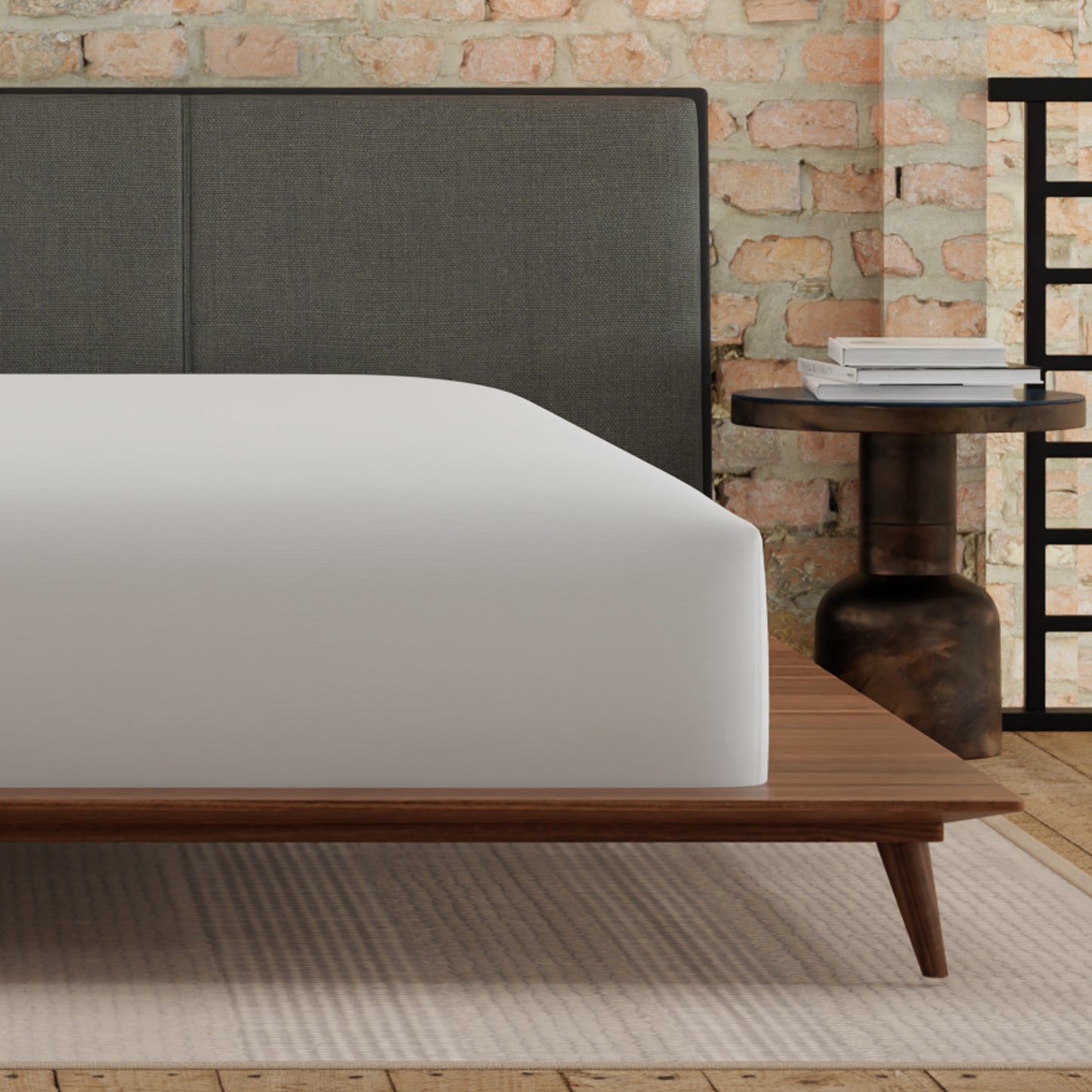 Dark grey upholstered headboard with clean stitching detail for a modern bed