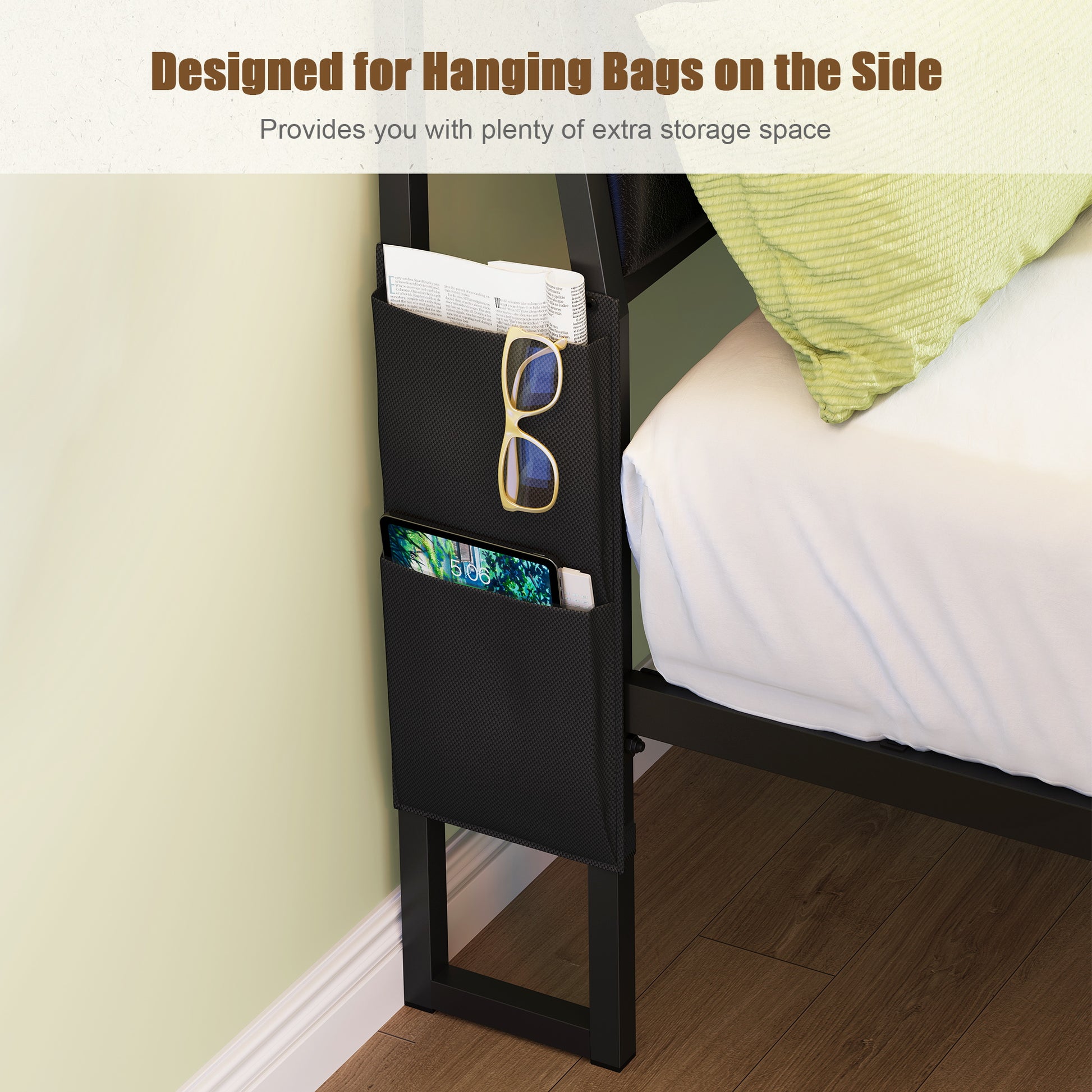 Black fabric bedside organizer with dual pockets holding glasses and phone
