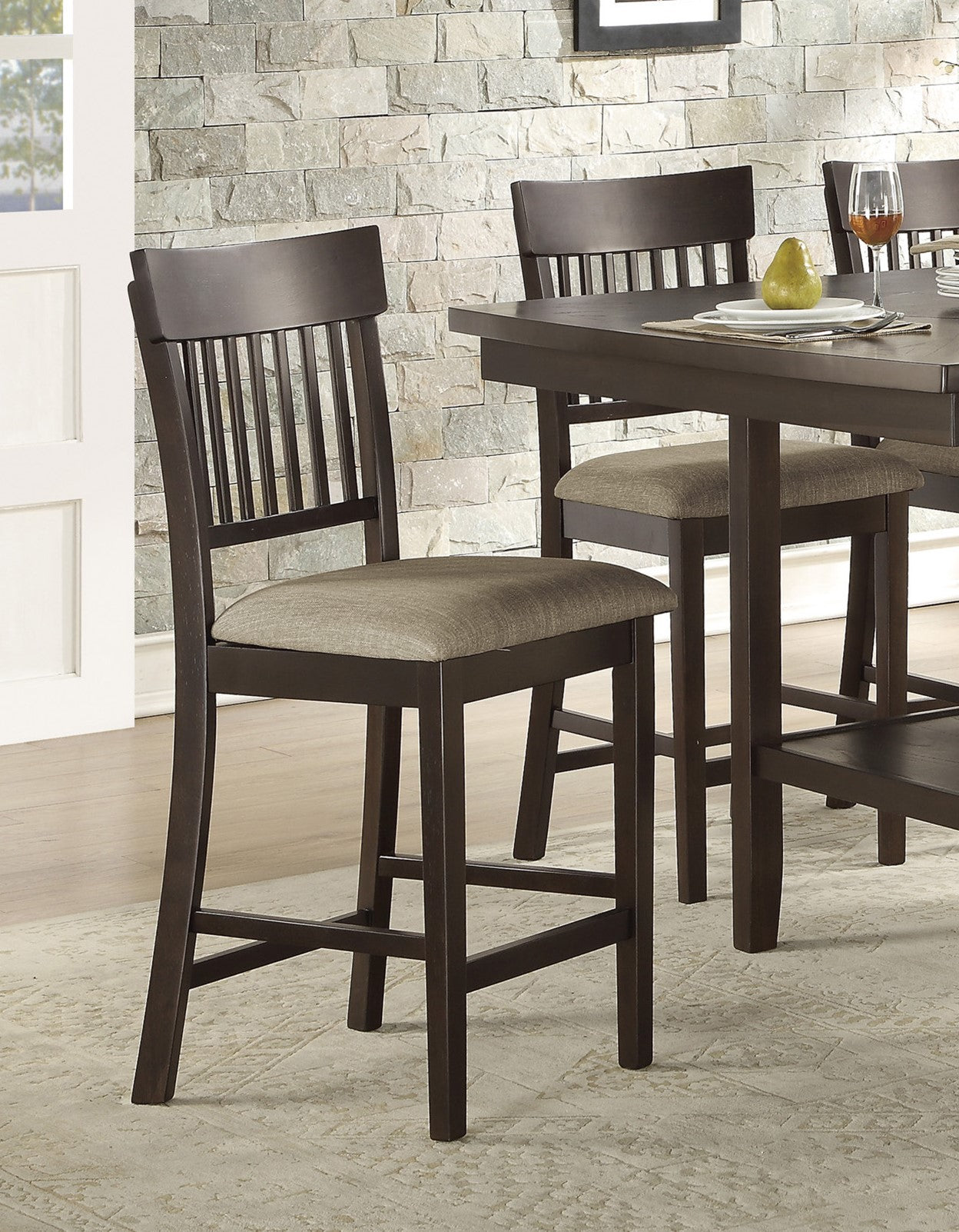 Dark brown wooden bar stool with slatted back and beige upholstered seat