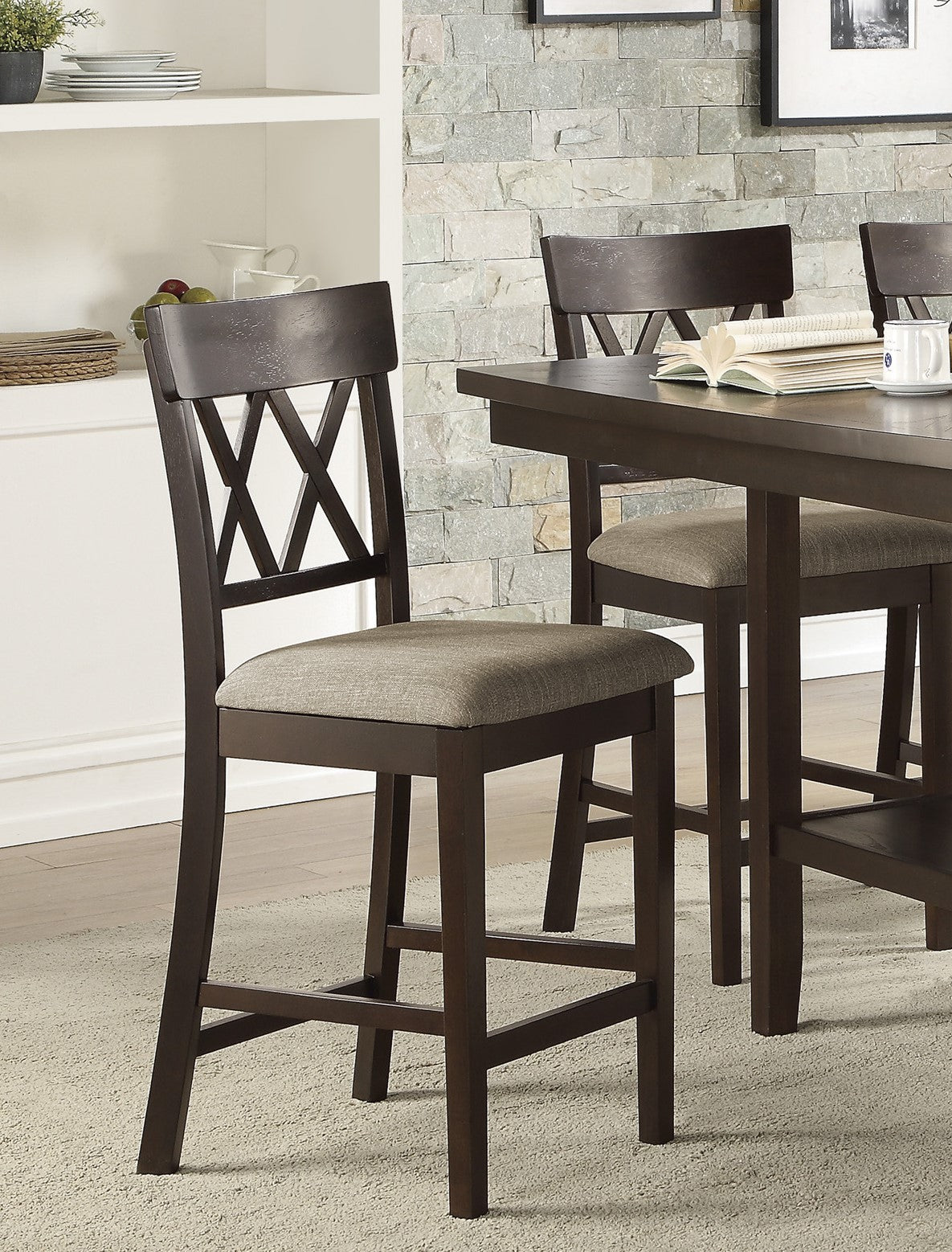 Dark brown wooden counter stool with Xback detail and grey fabric seat