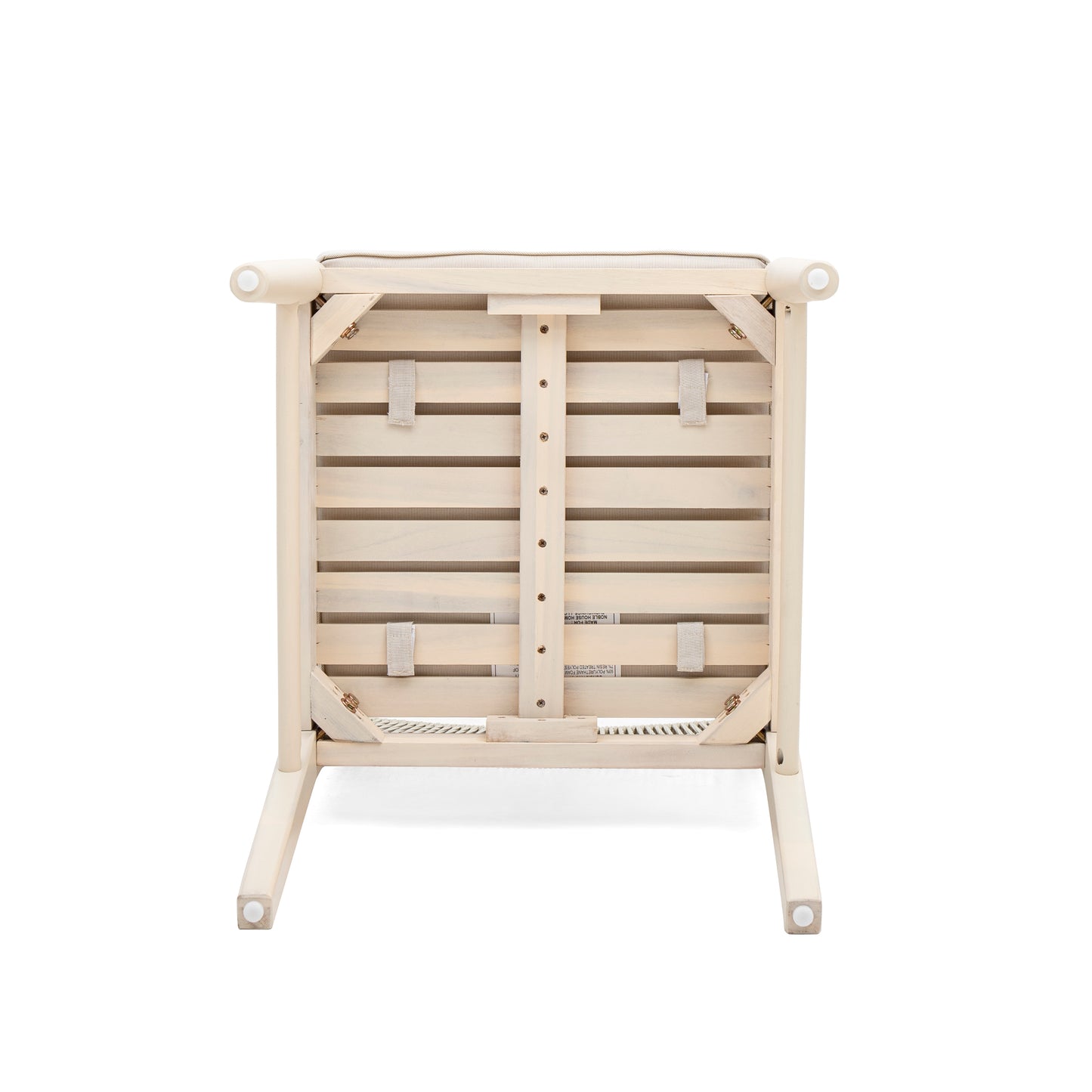 Underside of a natural wood armchair with white washed finish and woven seat support