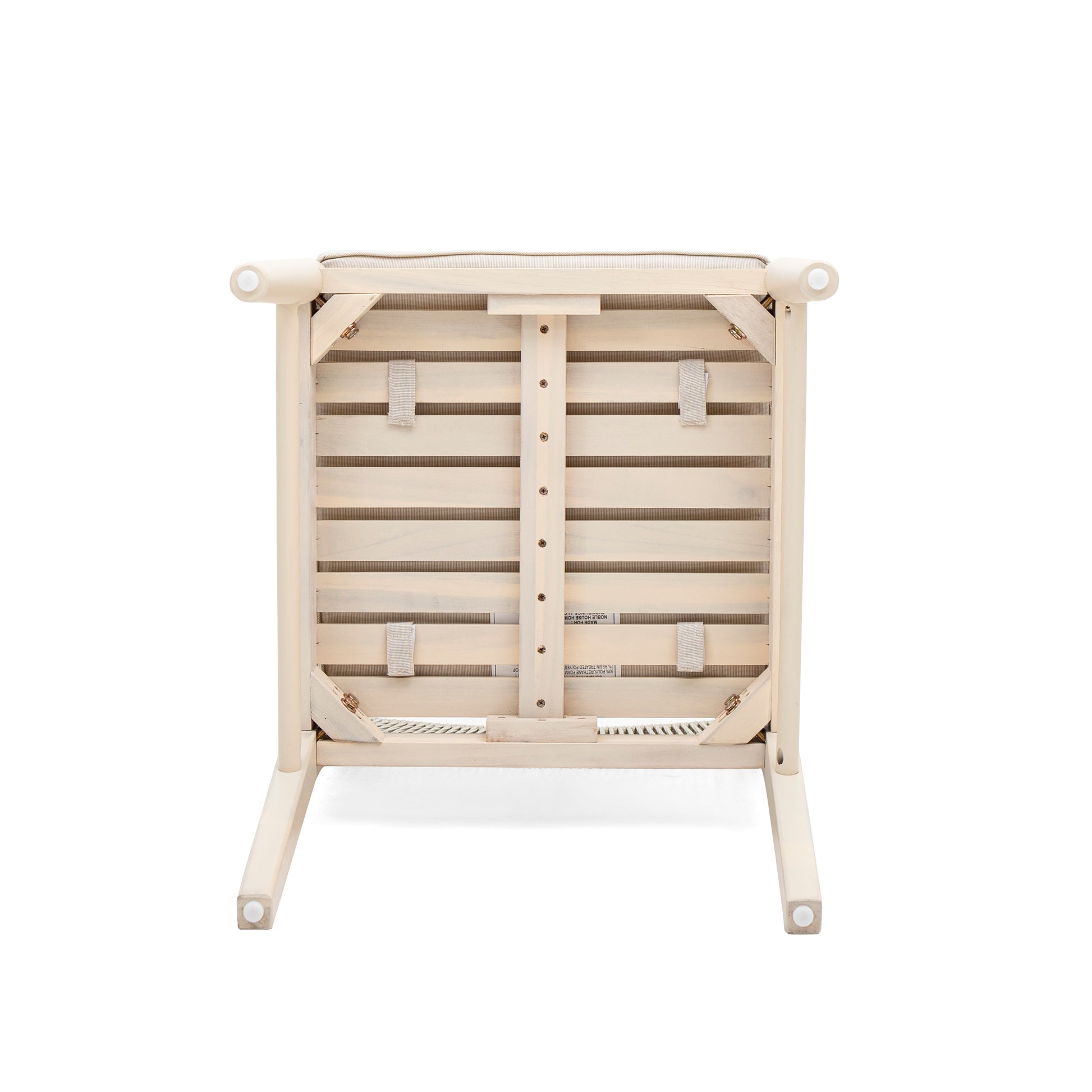 Underside of a natural wood armchair with white washed finish and woven seat support