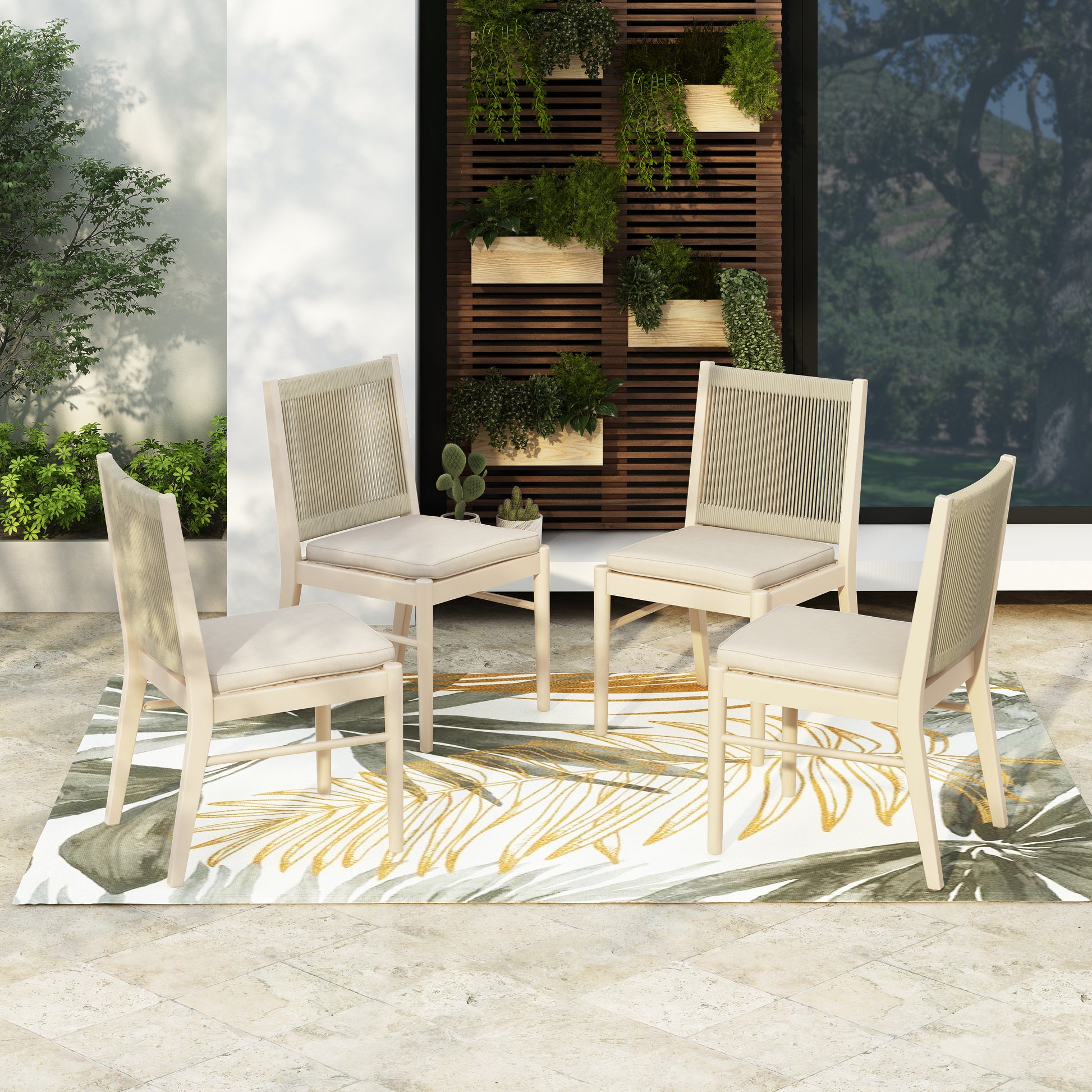 Four beige ropeback dining chairs with cream cushions arranged on a tropical leaf print rug