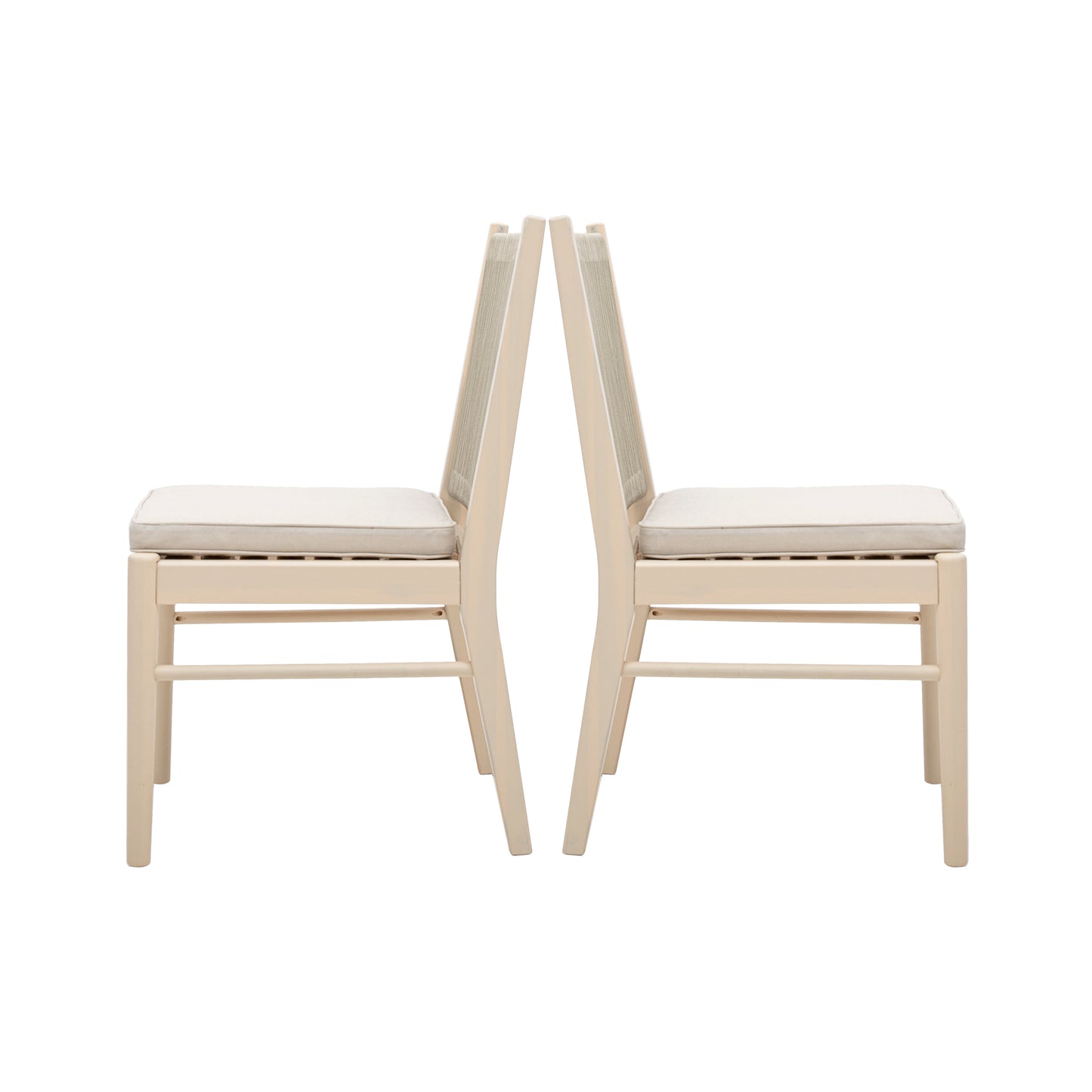 Two identical cream fabric dining chairs with light wood frames backtoback