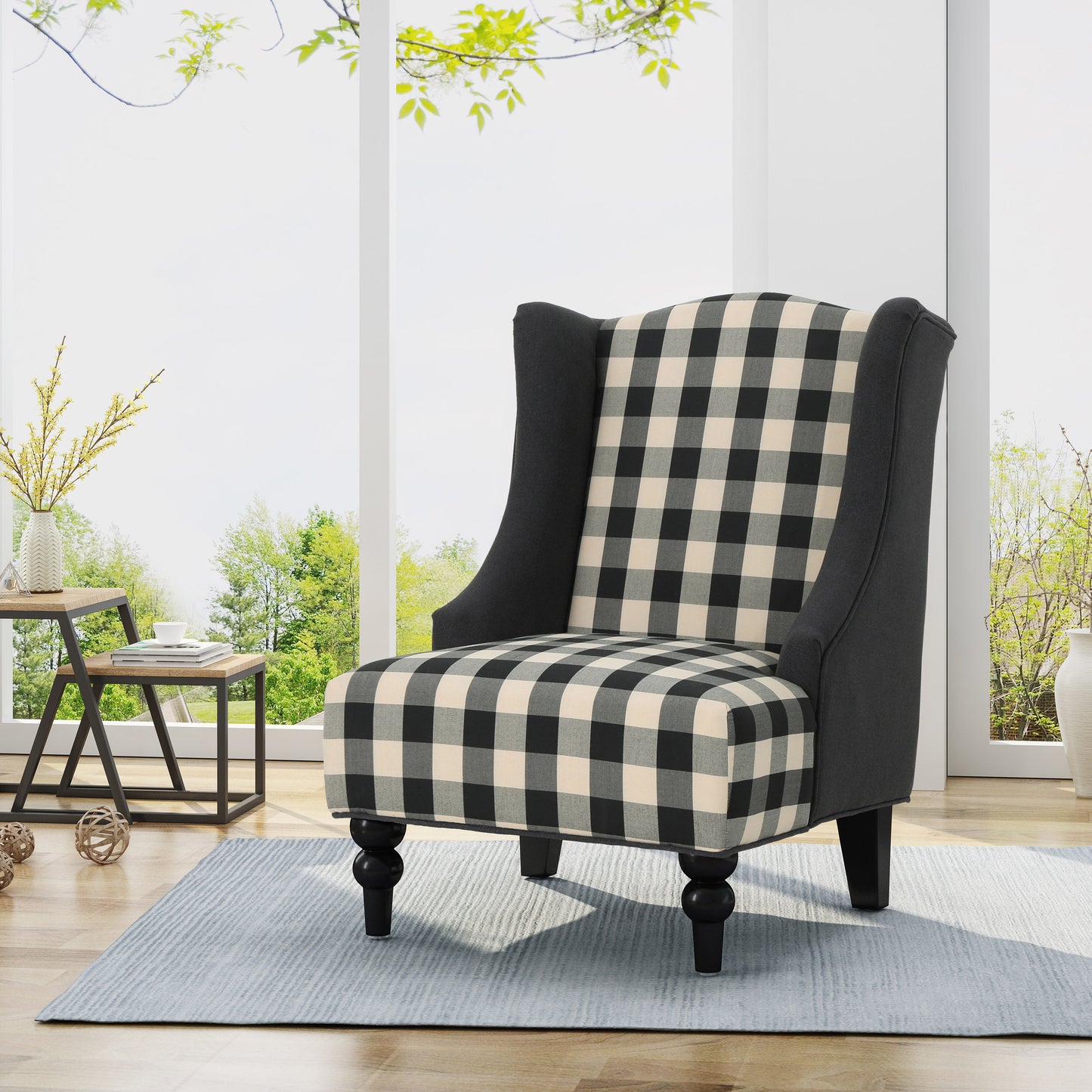 Black and cream buffalo check wingback chair with dark fabric sides and turned legs