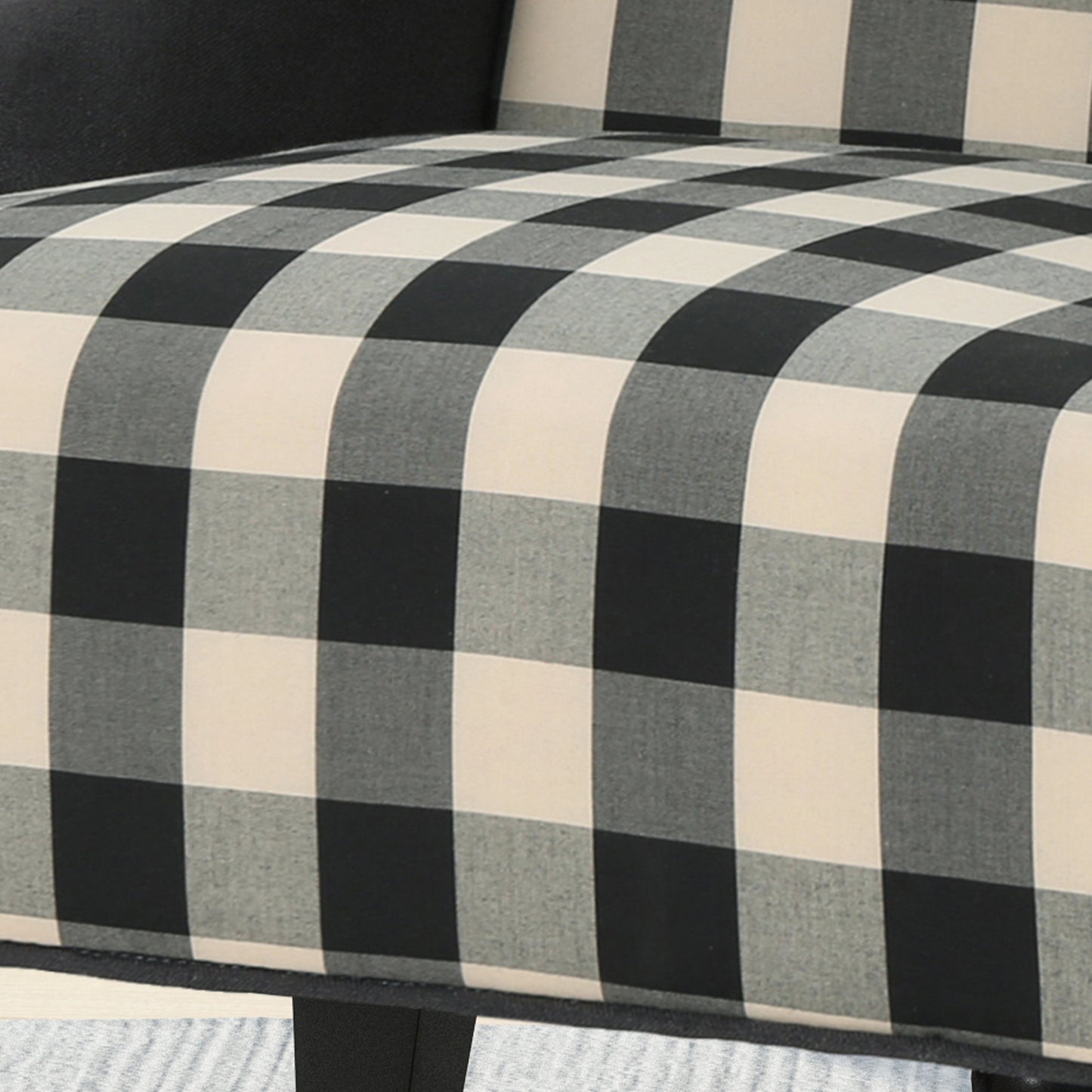 Black and cream buffalo check accent chair upholstery detail