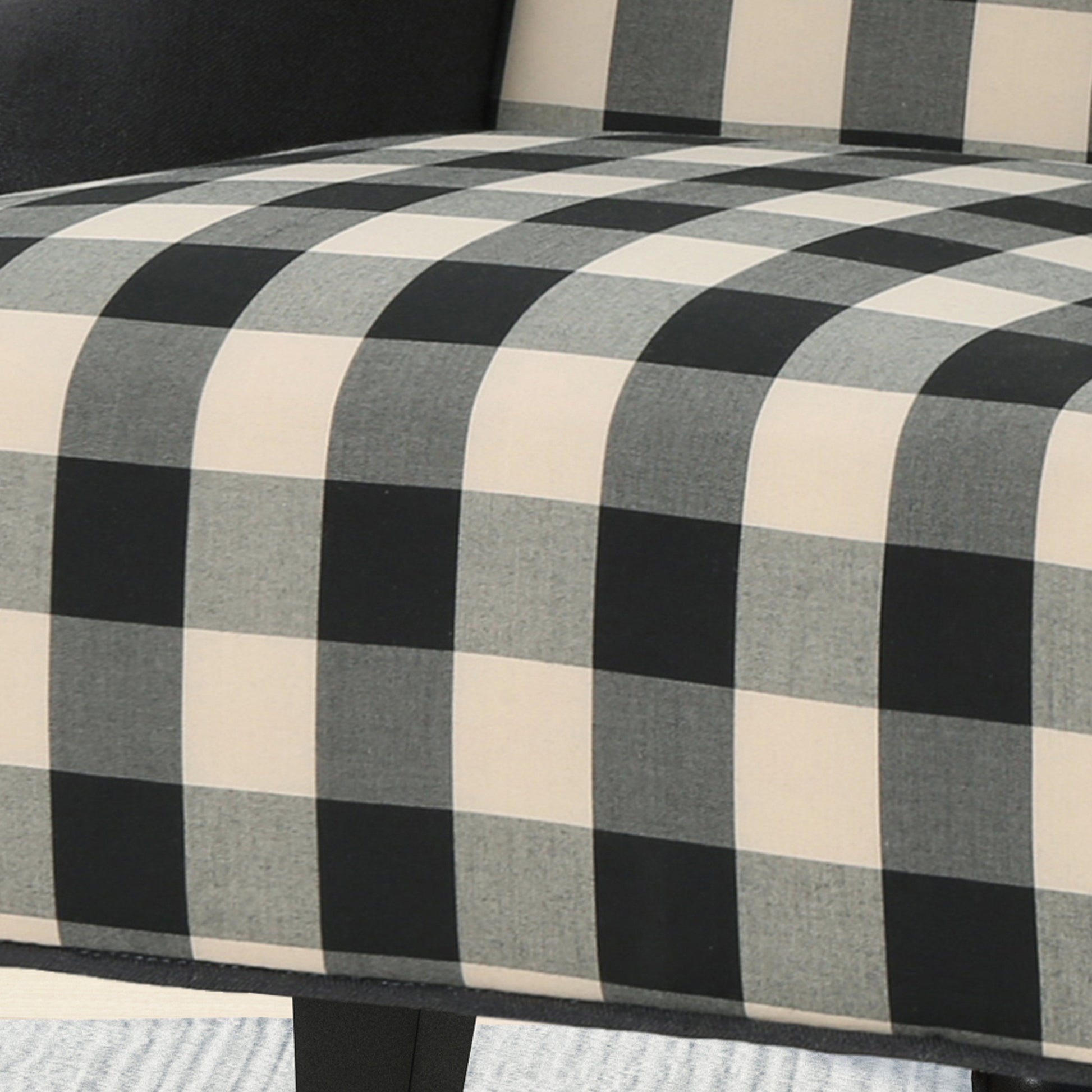 Black and cream buffalo check accent chair upholstery detail