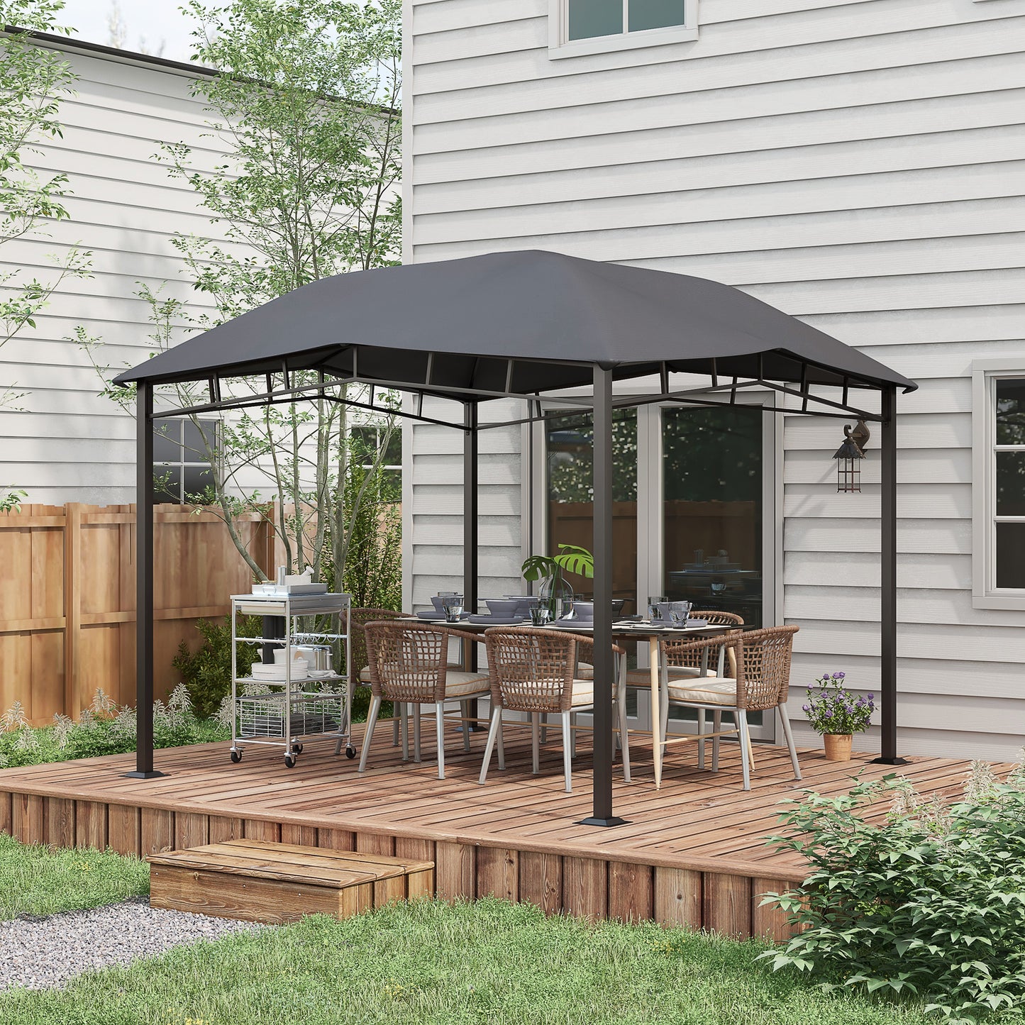 Gray outdoor gazebo with dining set and serving cart on wooden deck