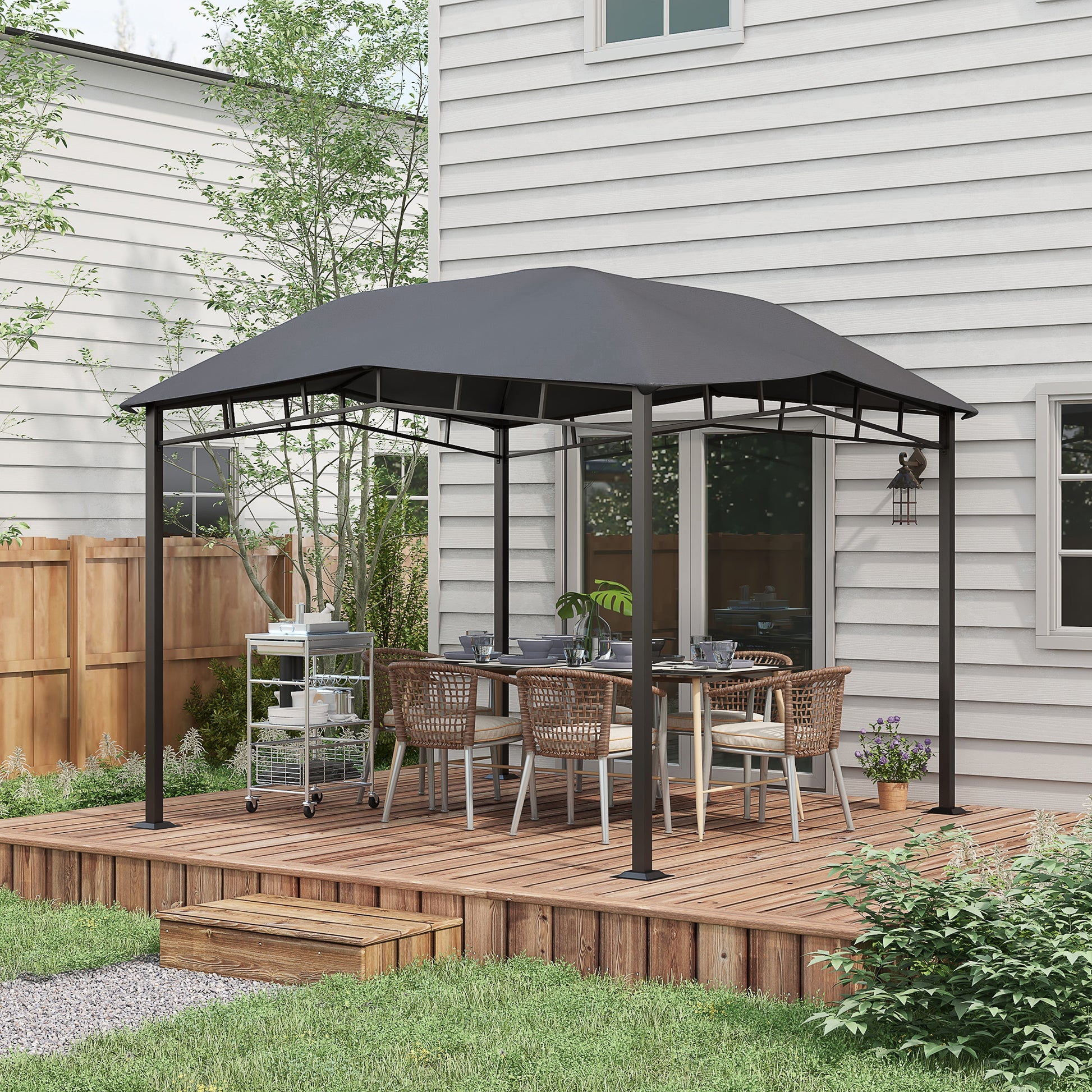 Gray outdoor gazebo with dining set and serving cart on wooden deck