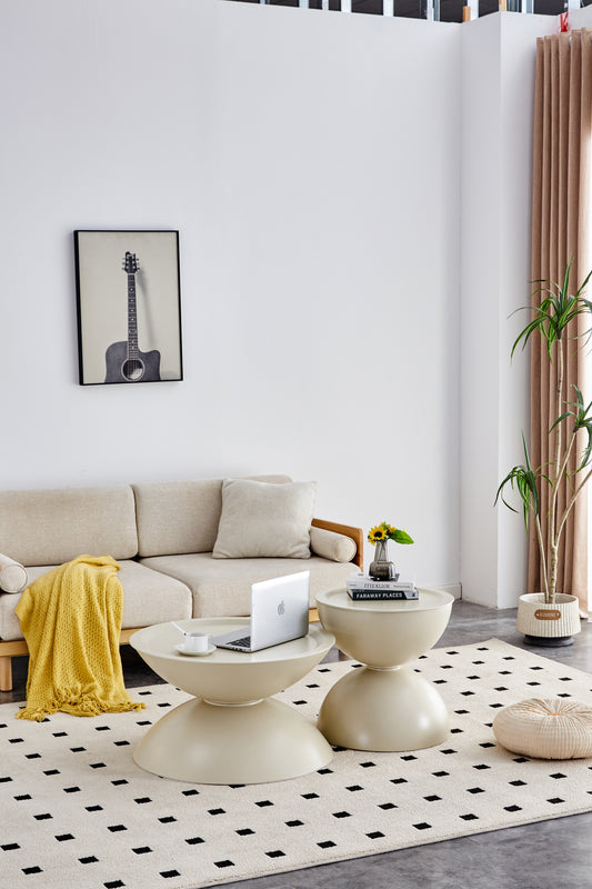Cream fabric sofa with a yellow throw blanket and accent pillows in a living room setting