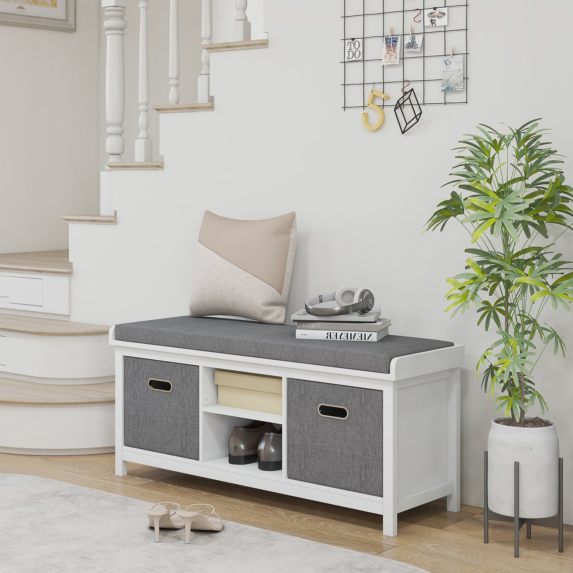 White entryway bench with gray upholstered seat and storage cubes