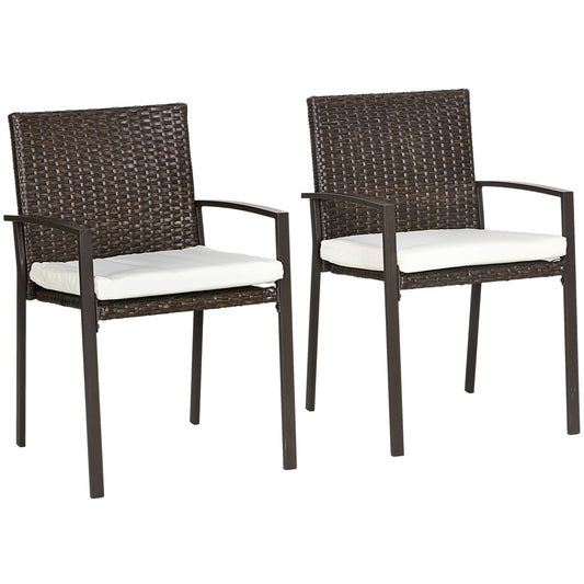 Two dark brown wicker patio chairs with white seat cushions on metal frames