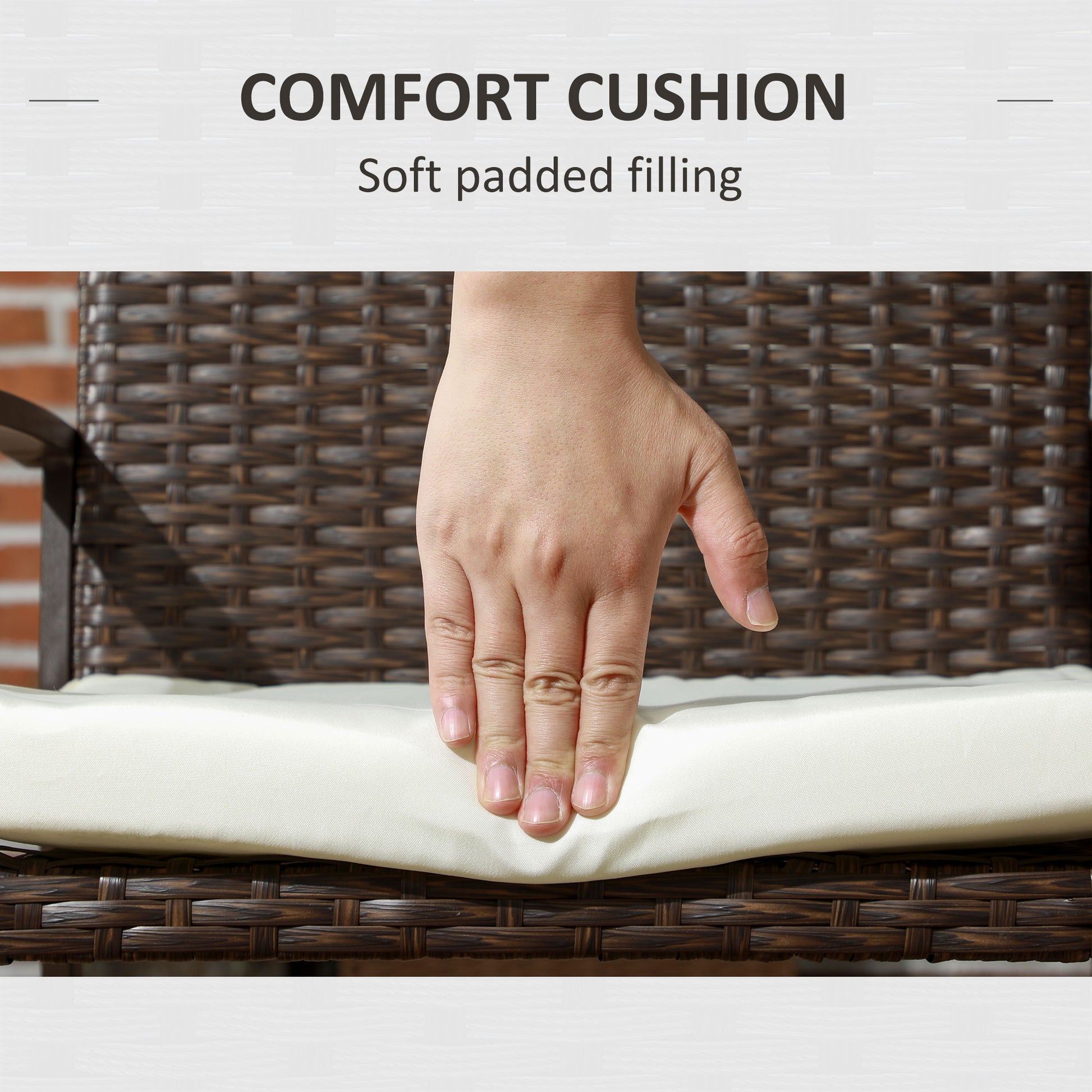 Hand pressing on a plush creamcolored outdoor cushion atop a dark brown wicker chair
