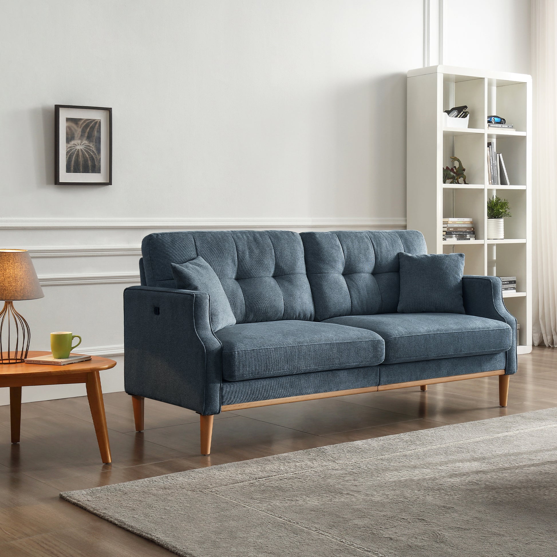 Tufted blue fabric sofa with wooden legs perfect for modern living rooms