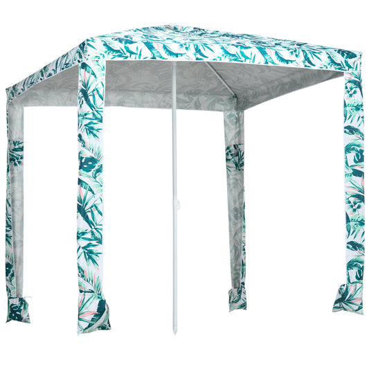 White beach tent with tropical leaf print and central pole