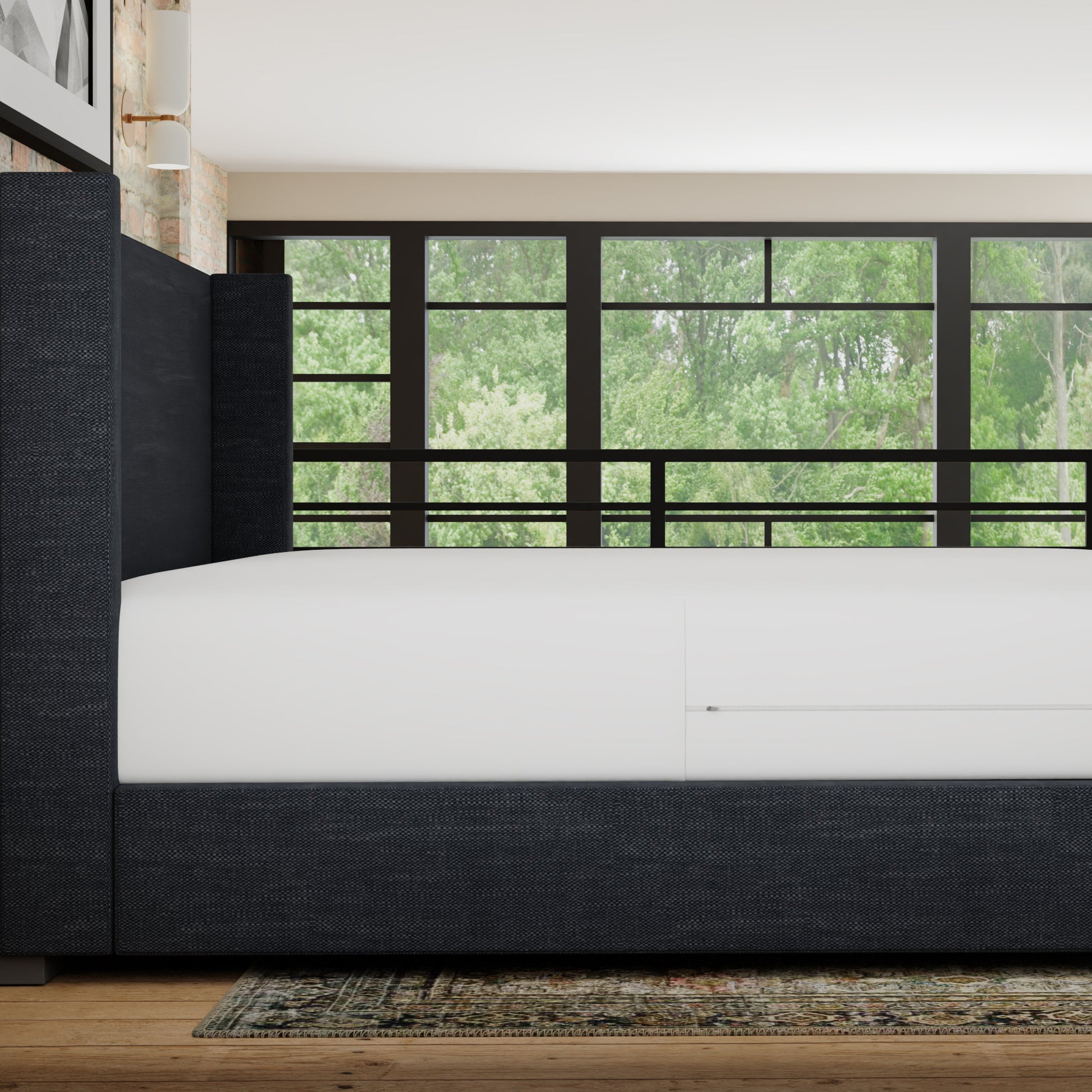 Charcoal grey upholstered king size bed frame with a tufted headboard and white mattress