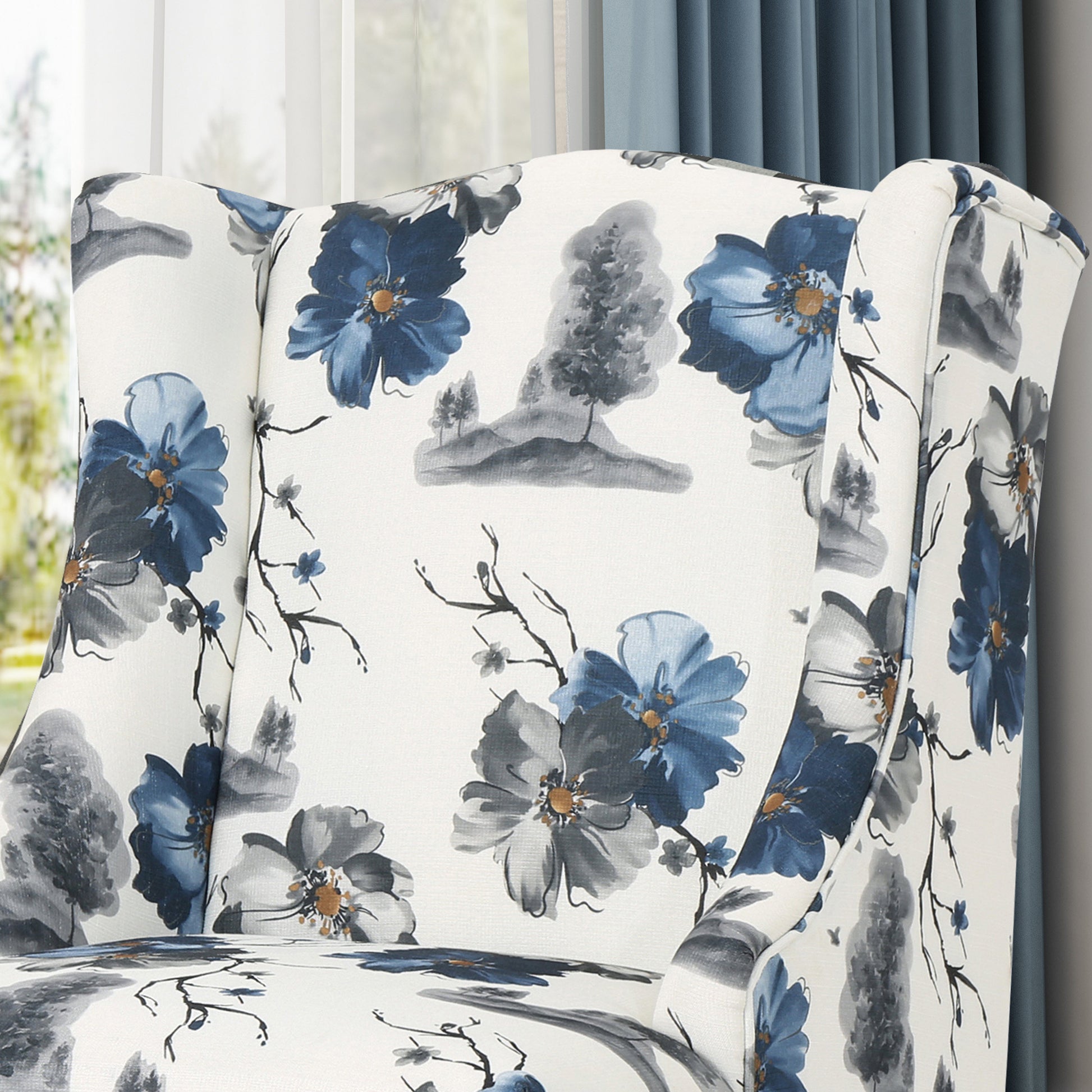 Floral wingback armchair with blue and grey flower print on white fabric