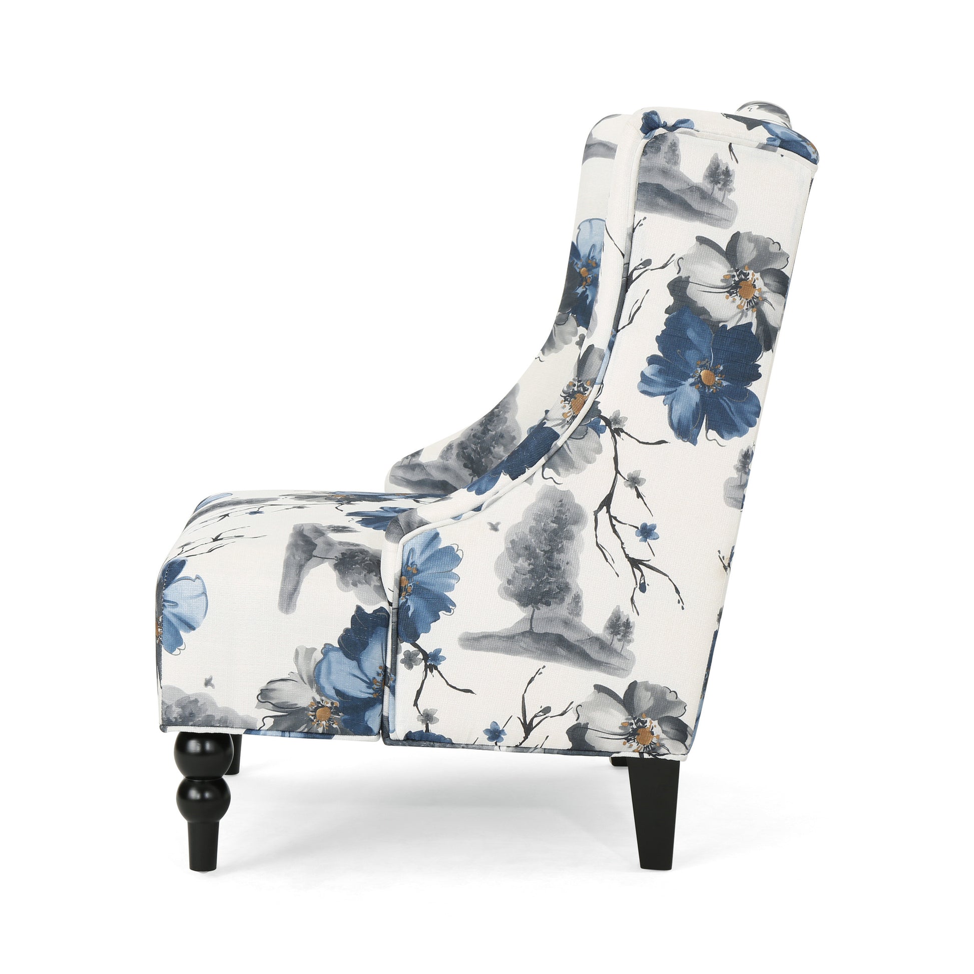 Wingback accent chair with blue floral pattern and carved wooden legs