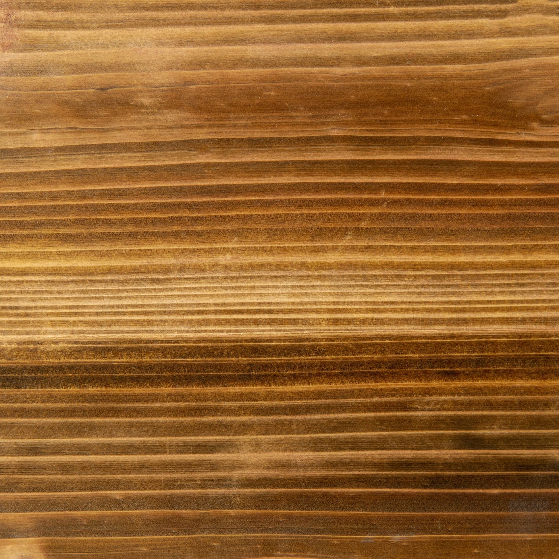 Closeup of a textured warmtoned wood grain surface with visible horizontal lines