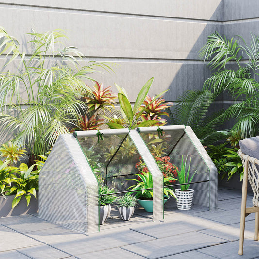 Mini greenhouse with shelves perfect for small plants and seedlings on a patio