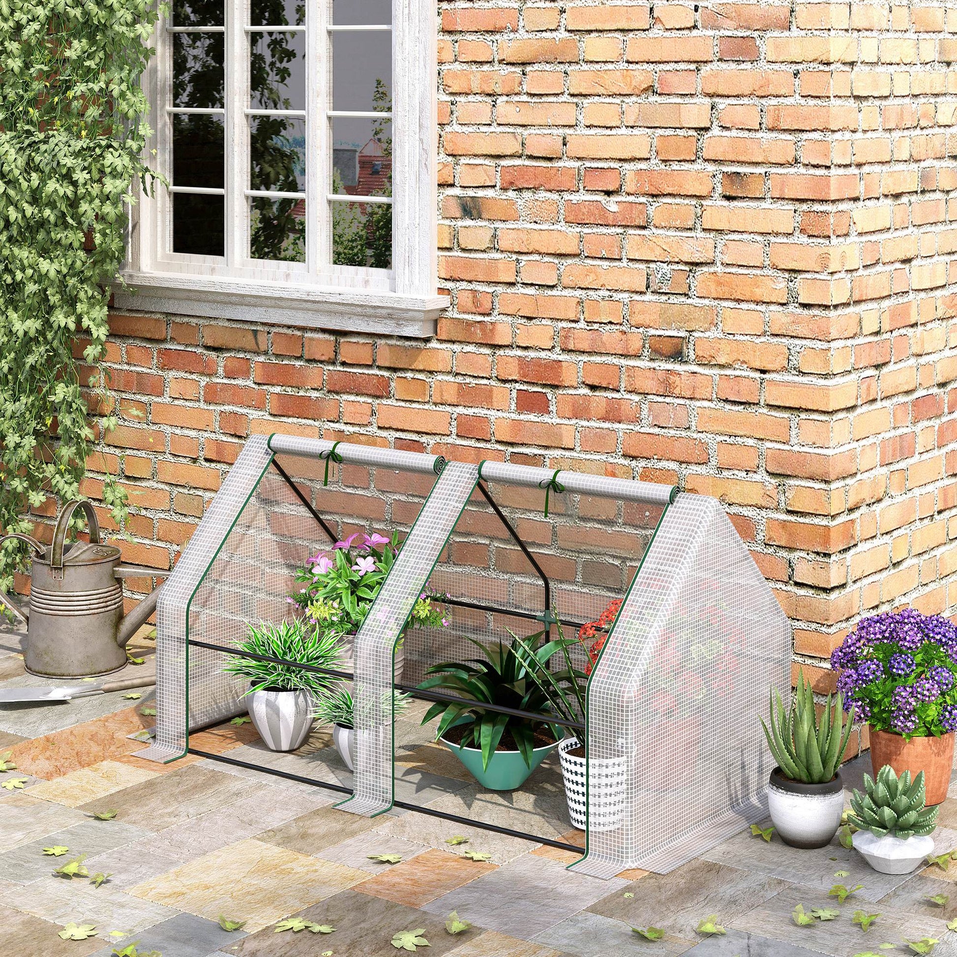 Mini greenhouse with wire shelving and clear cover ideal for small gardens