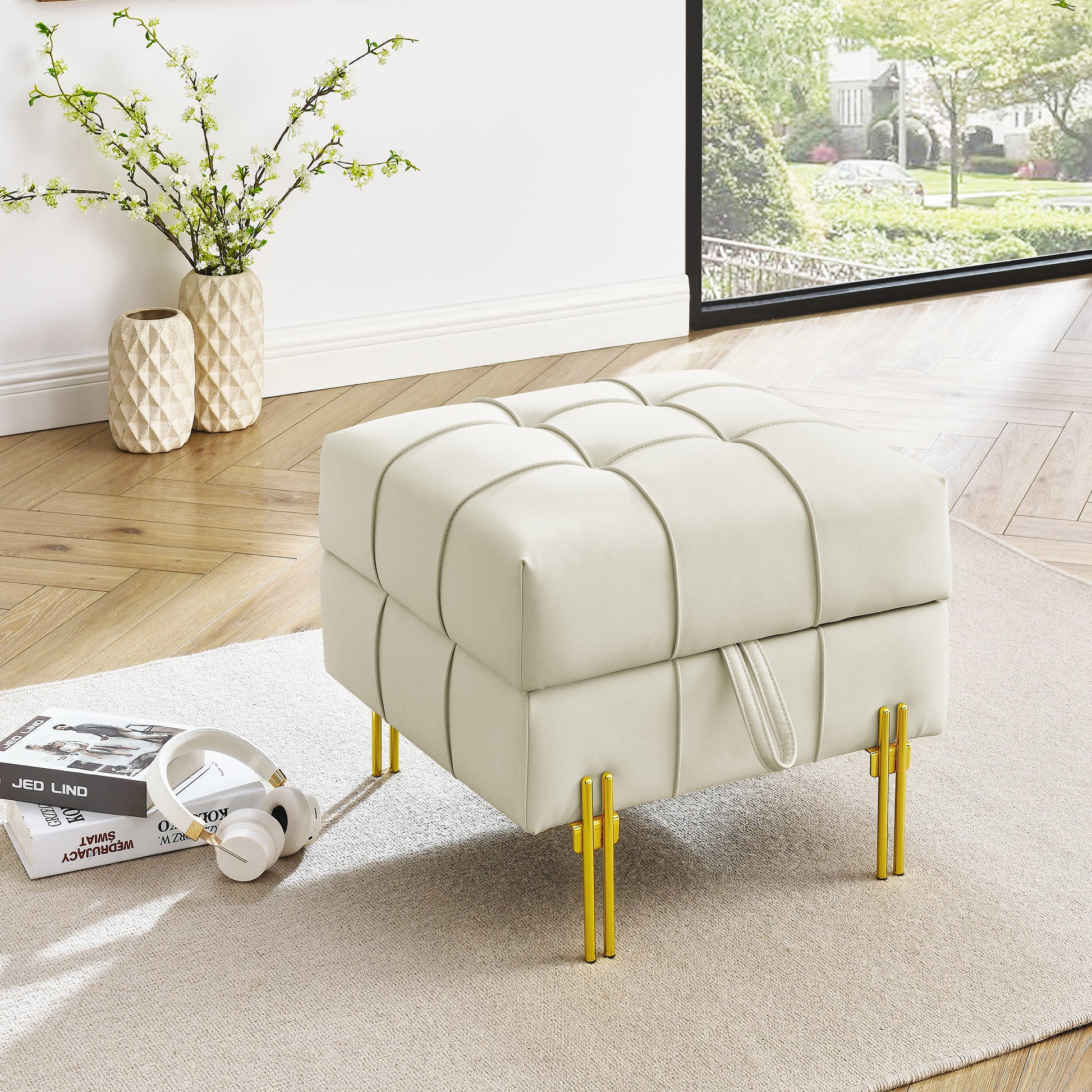 Cream leather tufted storage ottoman with modern gold metal legs