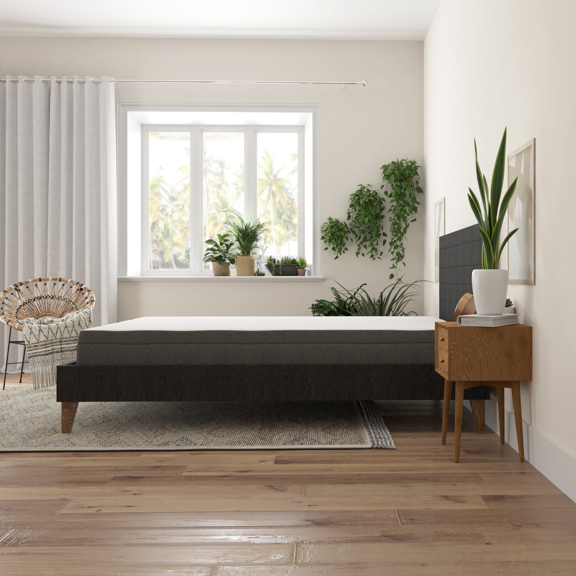 Dark gray upholstered queen mattress with white top layer on a dark wood bed frame
