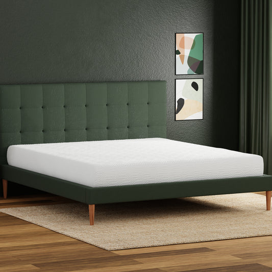Green upholstered platform bed frame with tufted headboard and white mattress