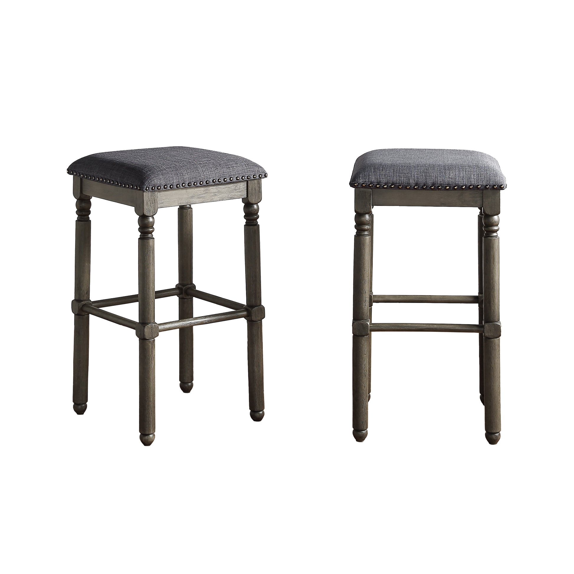 Grey upholstered bar stool with distressed wooden legs and nailhead trim