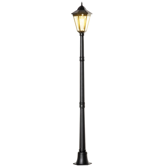 Black traditional post lantern with hexagonal glass panes and a pointed finial