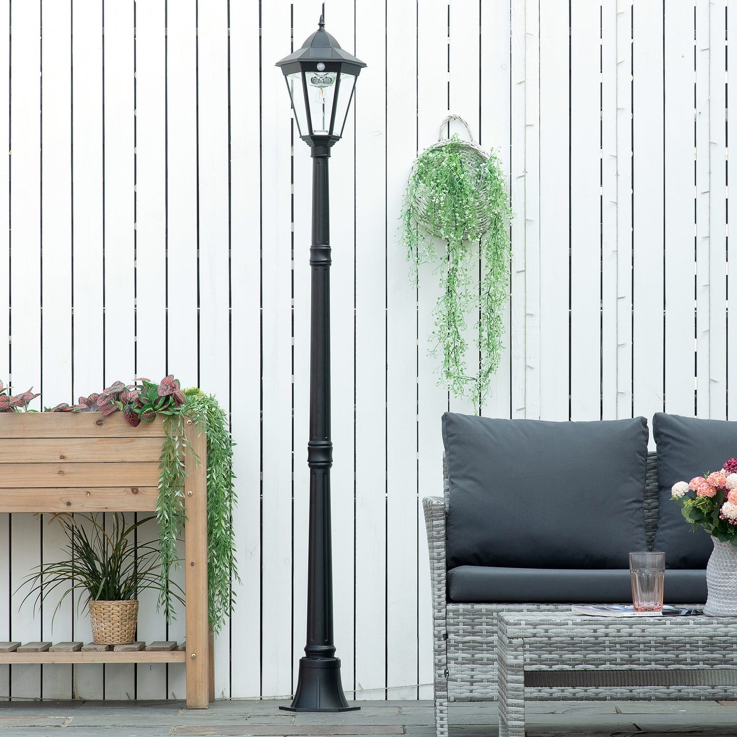 Black vintagestyle solar street lamp with a faceted glass lantern