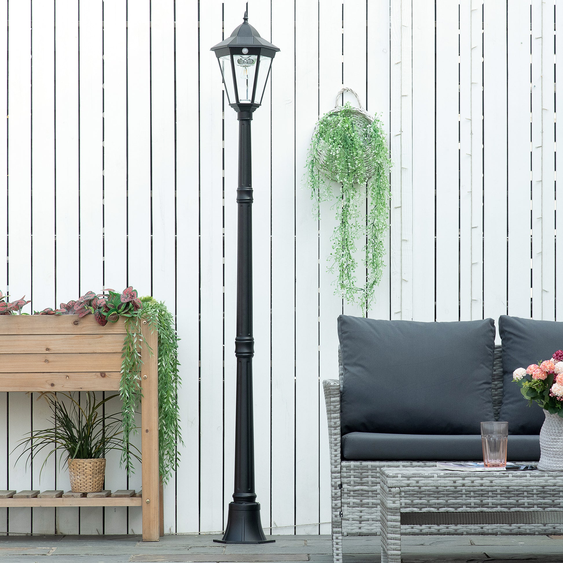 Black vintagestyle solar street lamp with a faceted glass lantern