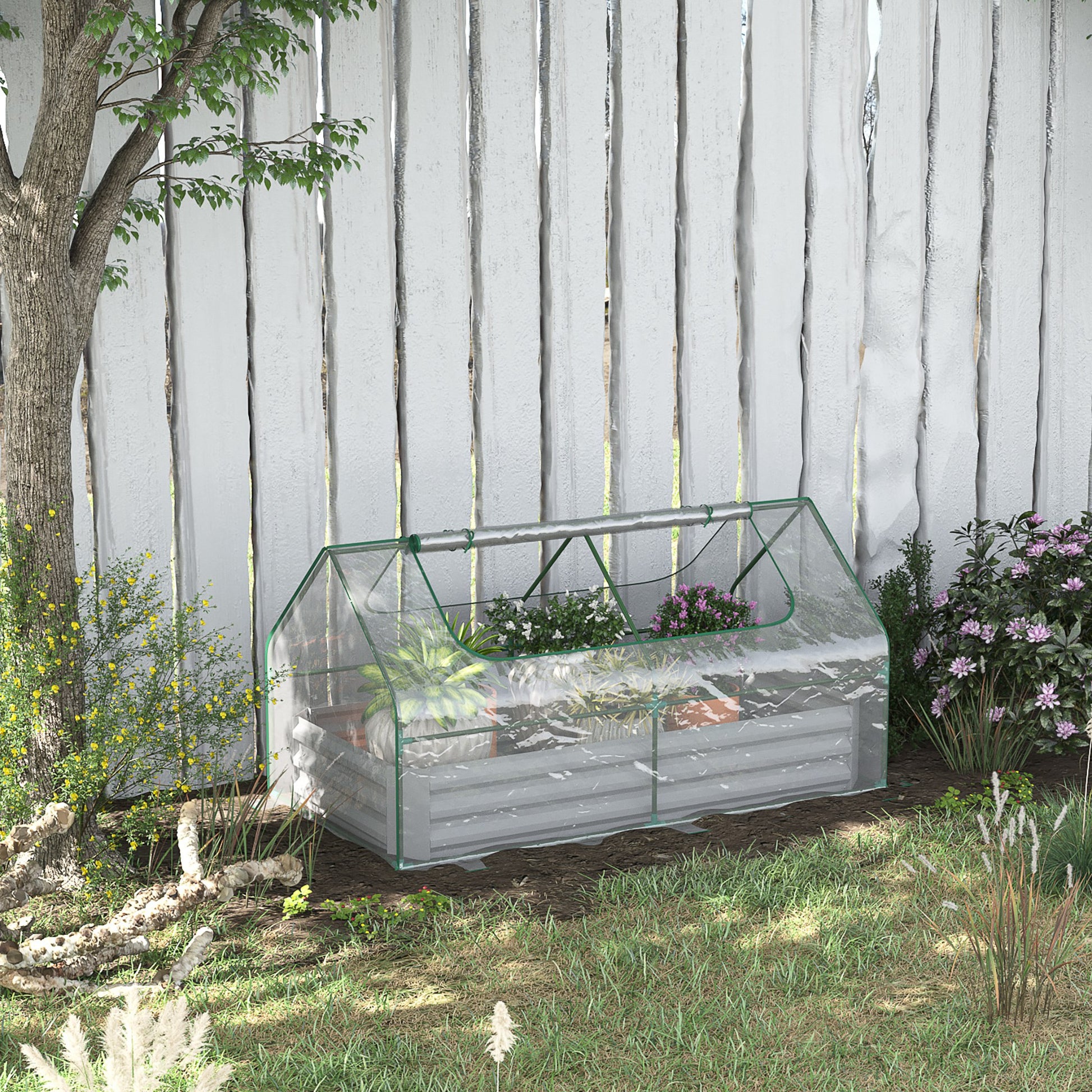 Transparent portable greenhouse with green trim housing various potted plants and flowers