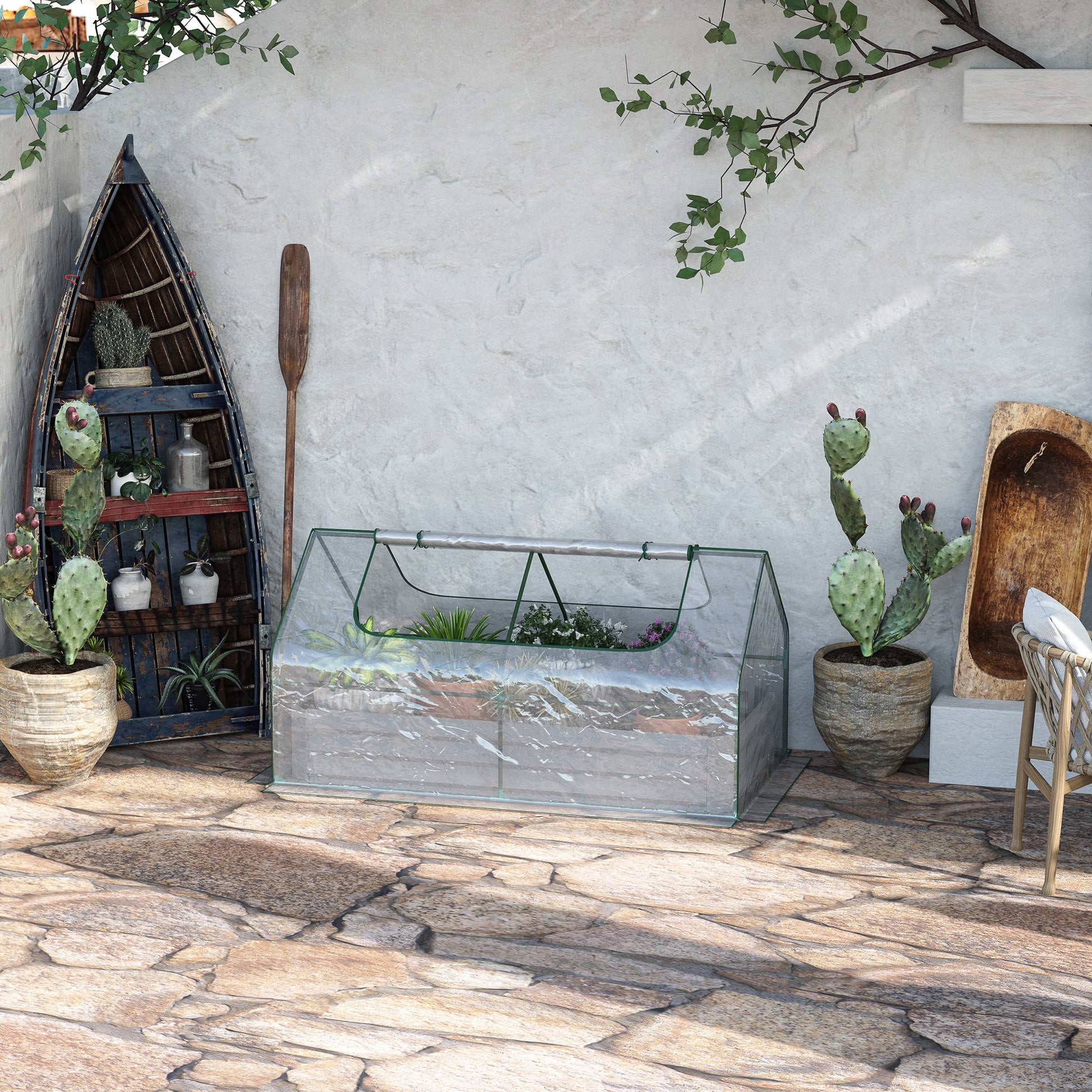 Small portable greenhouse with transparent cover and green trim for seed starting