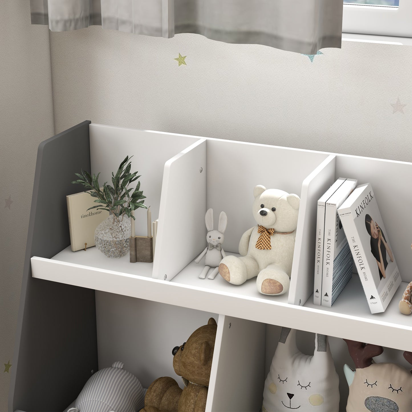 White plush teddy bear with orange and brown checkered scarf on a bookshelf