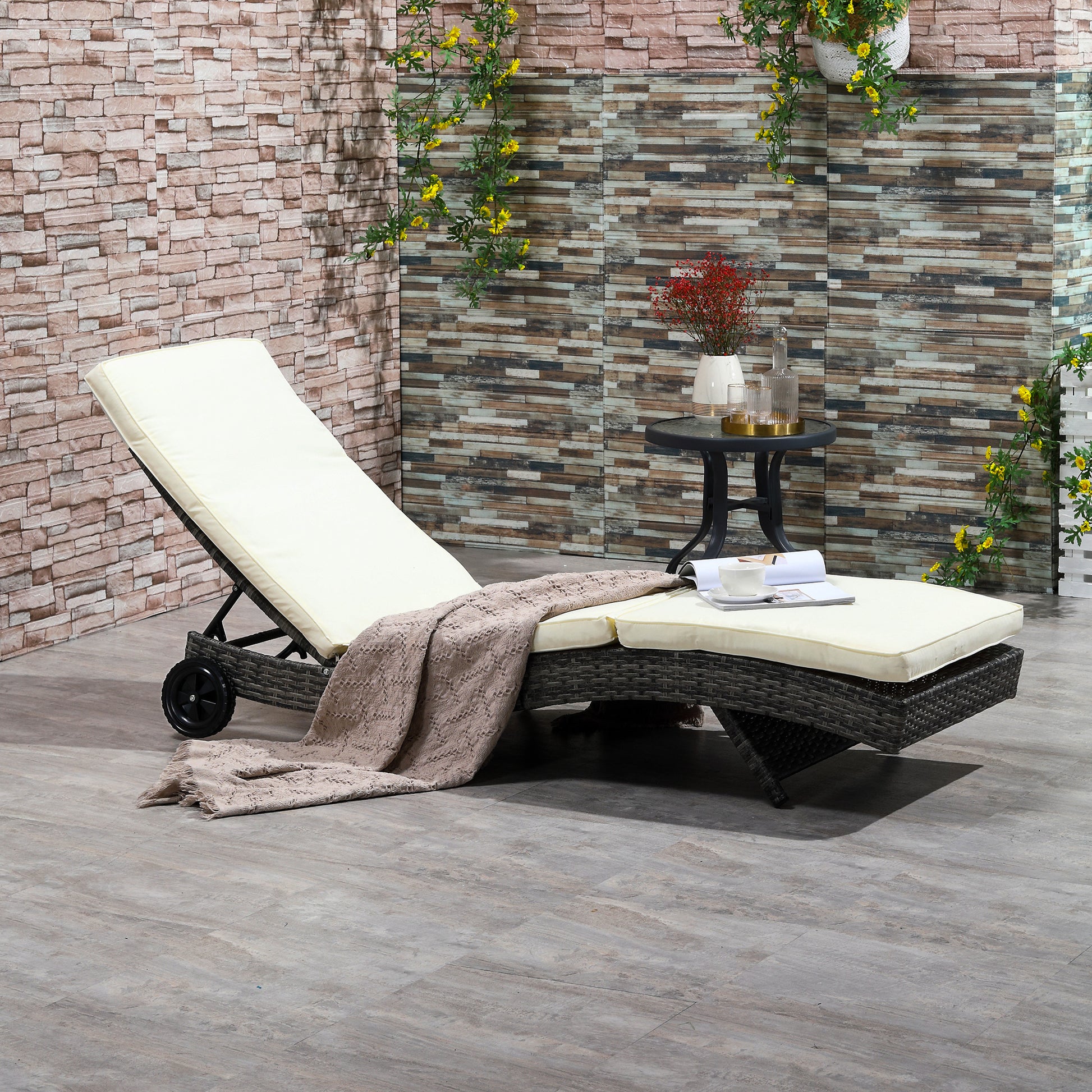 Outdoor wicker chaise lounge with adjustable back and cream cushions perfect for relaxation