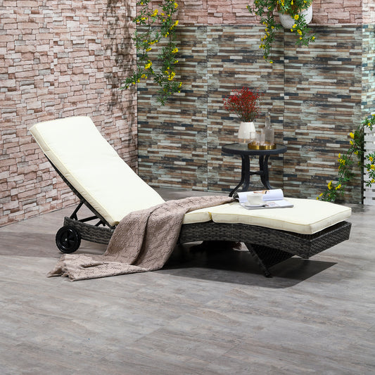 Outdoor wicker chaise lounge with adjustable back and cream cushions perfect for relaxation