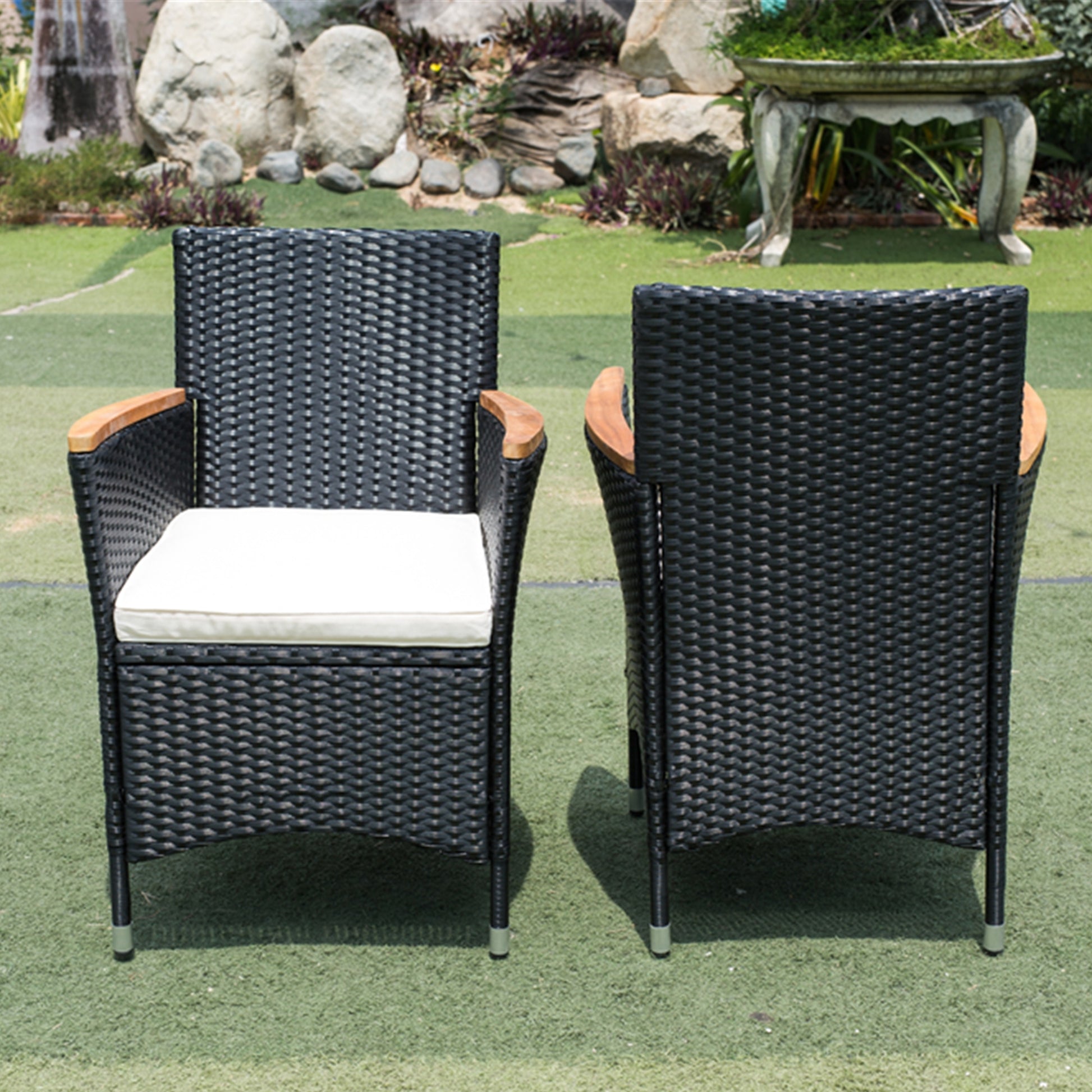 Black wicker patio chair with white cushion and wood armrests outdoor furniture