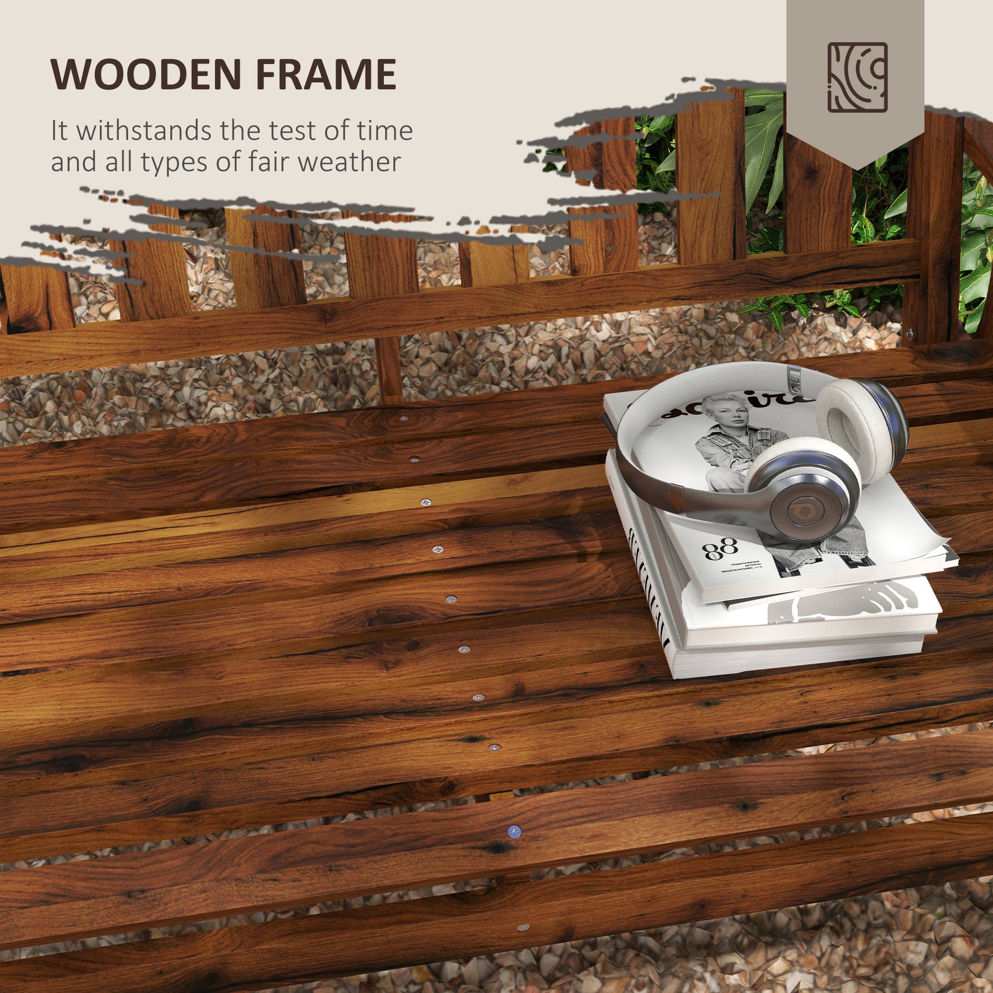 Rich brown wooden park bench with stacked books and headphones on seat