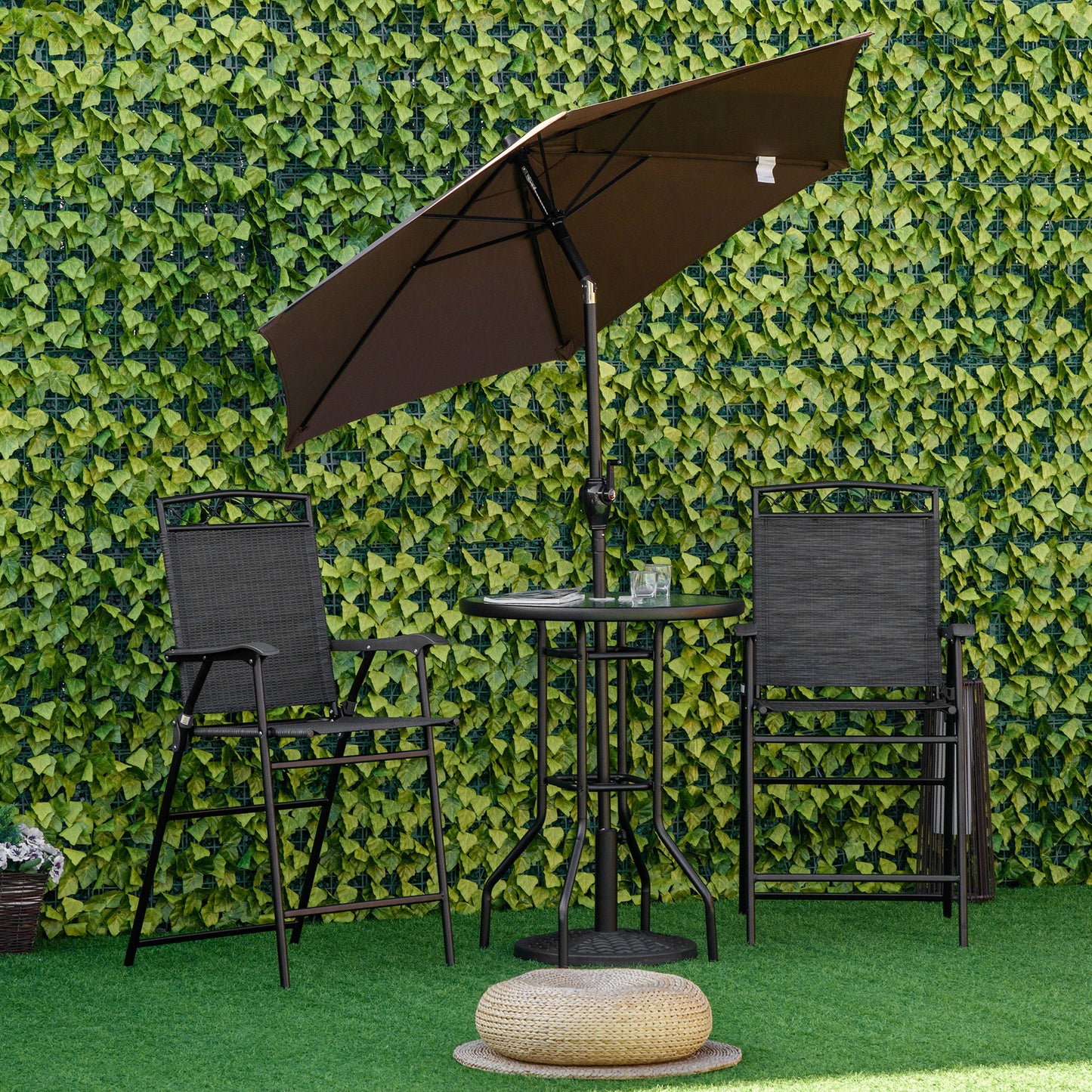 Black metal bar stools with woven seats and backs paired with a small round bistro table and brown umbrella